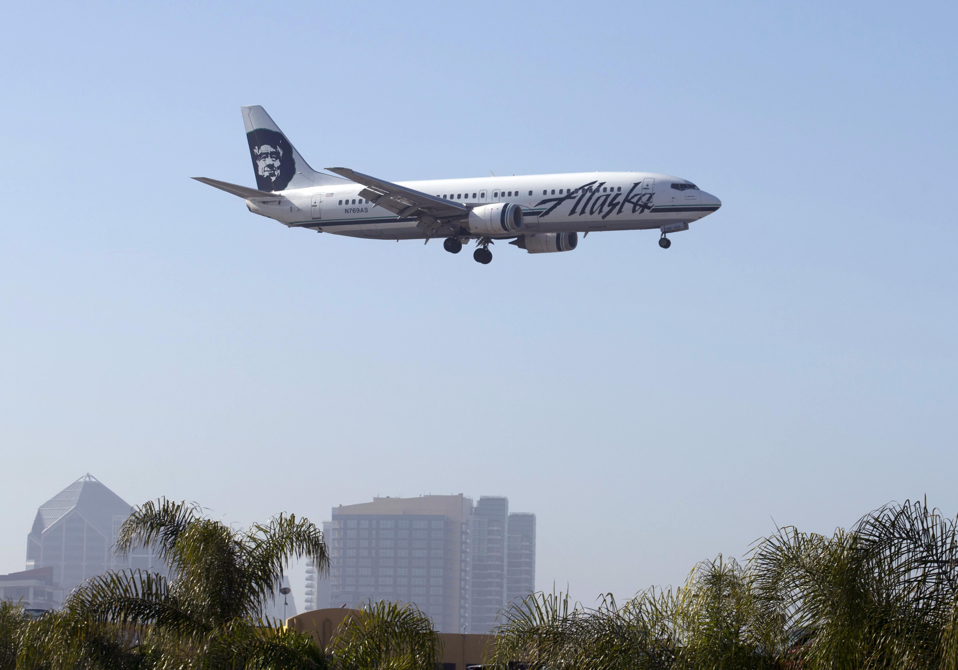 An Alaska Airlines Boeing 737 plane is shown on final approach to land in San Diego