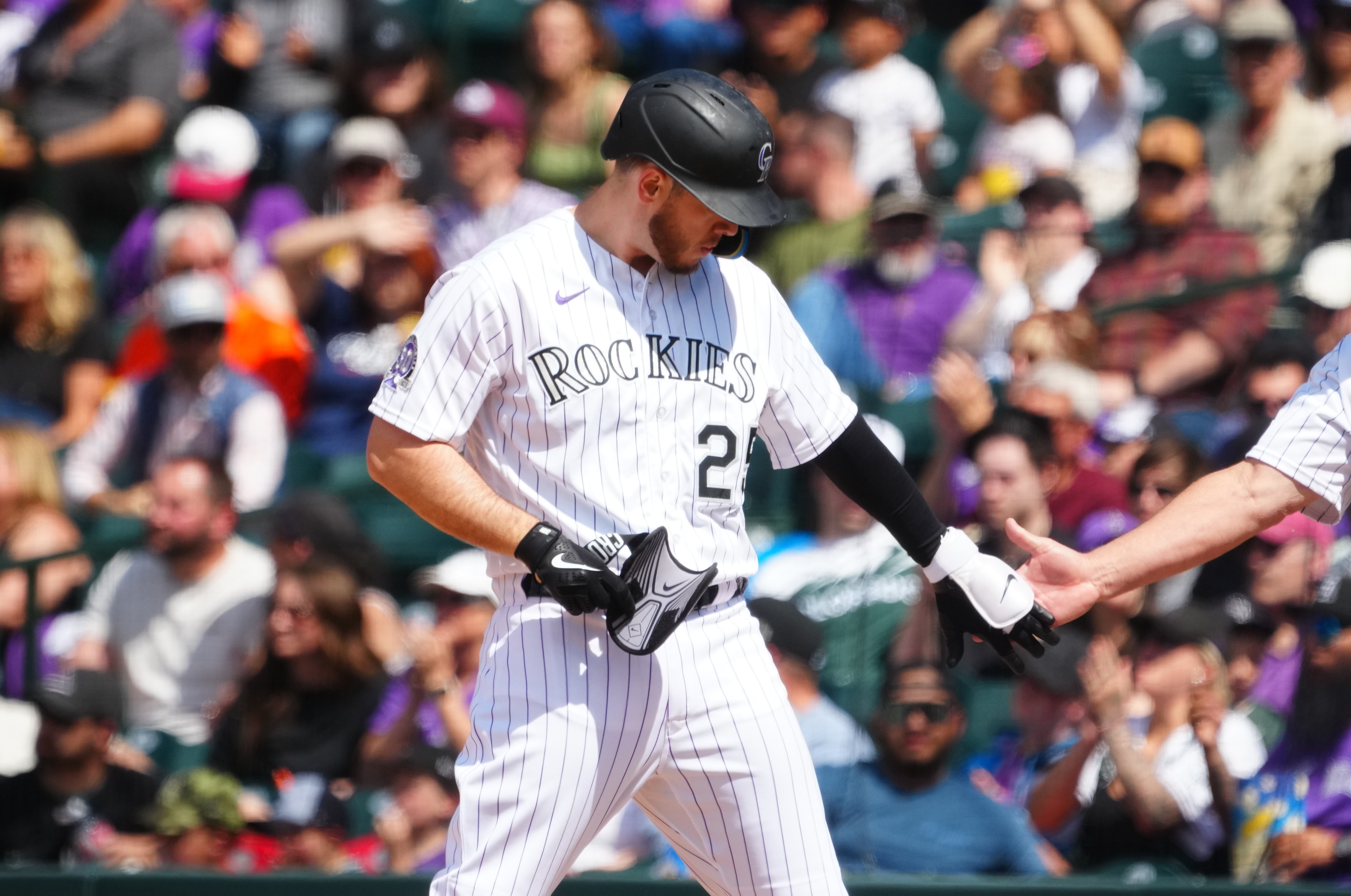 Rockies offense explodes in 12-4 win to avoid sweep