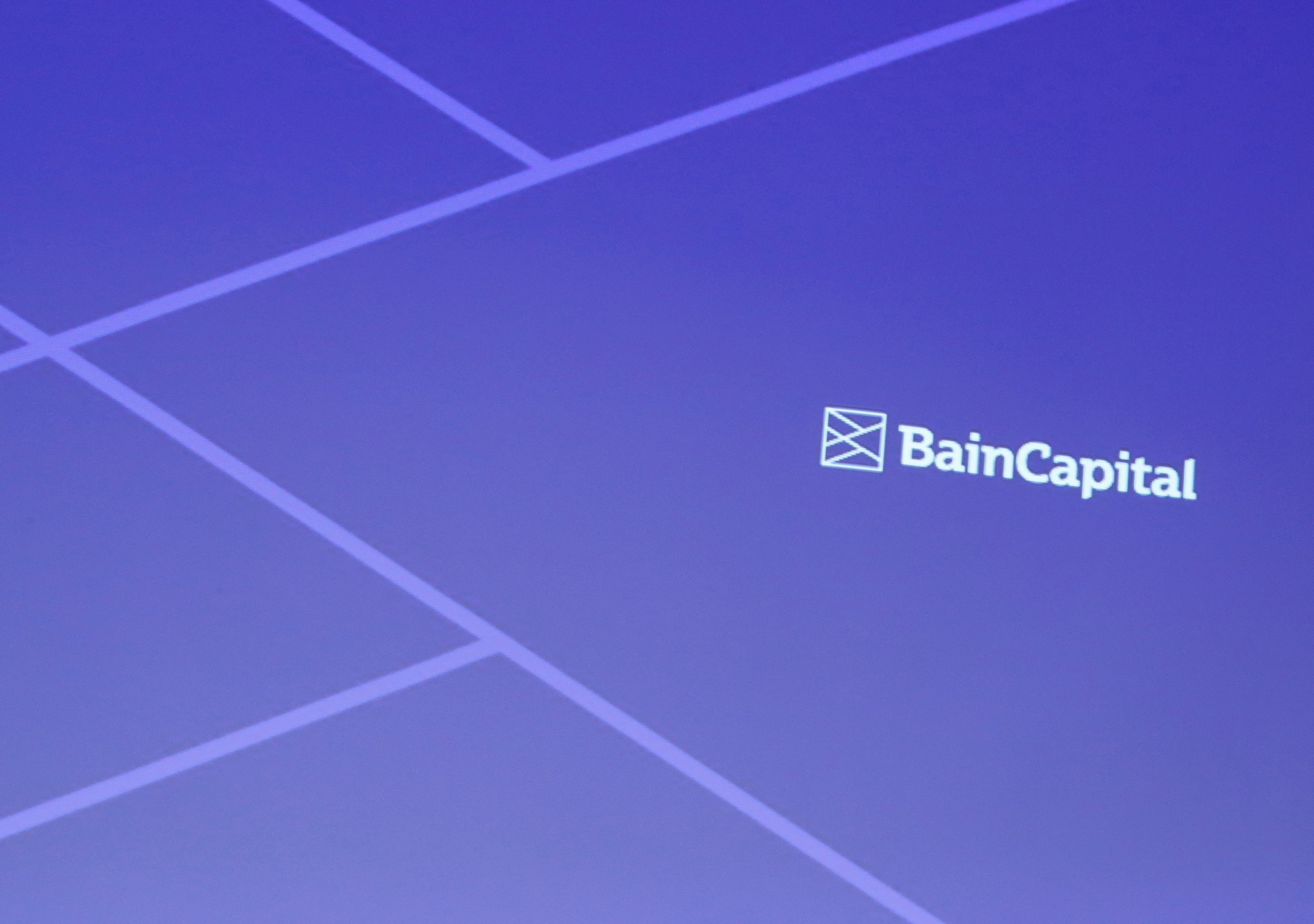 Logo of Bain Capital is screened at a news conference in Tokyo, Japan