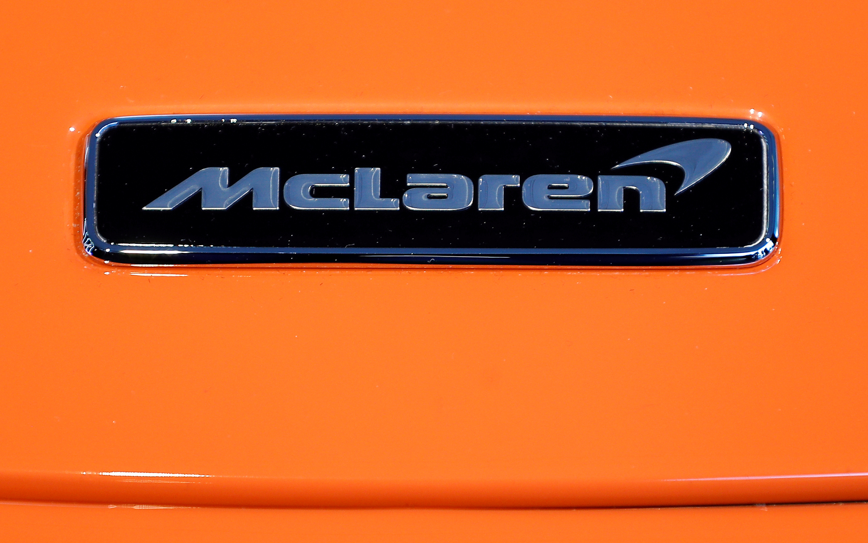 The McLaren logo is seen on the McLaren 765LT at its launch at the McLaren headquarters in Woking