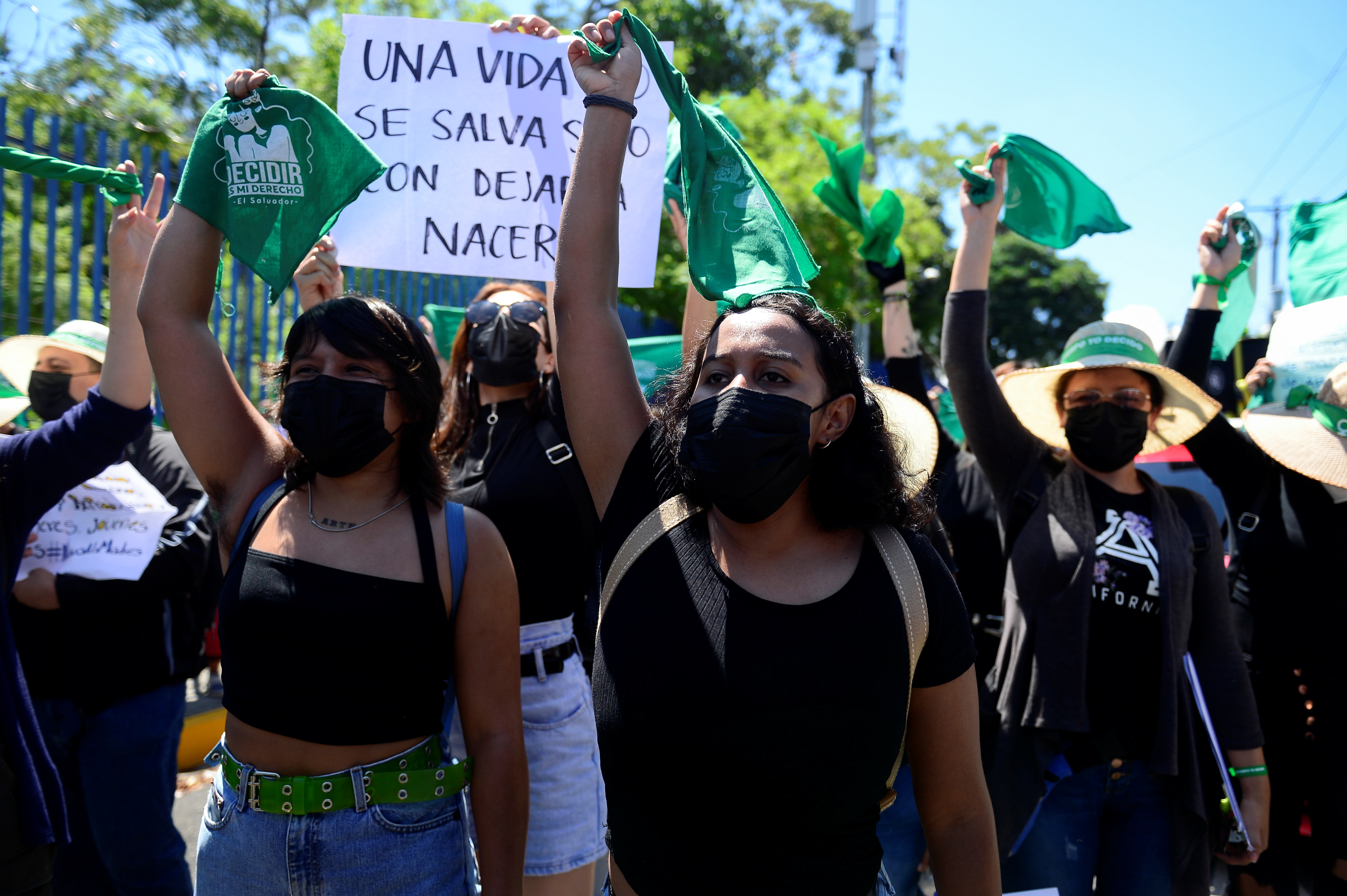 Women hold up green handkerchiefs, symbolizing the abortion rights movement, during a protest to mark International Safe Abortion Day in San Salvador, El Salvador, September 28, 2021. REUTERS/Jessica Orellana