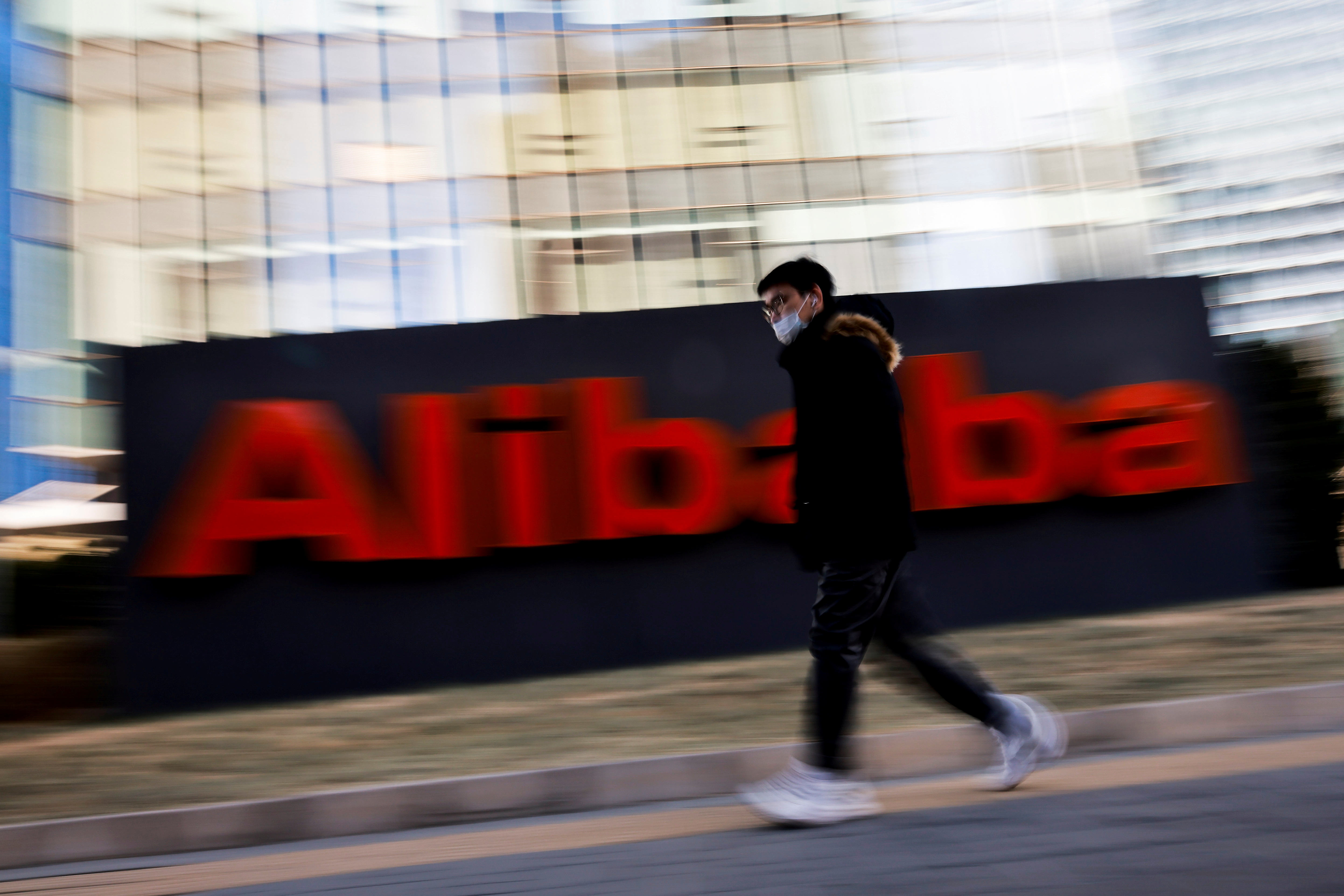 The logo of Alibaba Group is seen at its office in Beijing, China January 5, 2021. REUTERS/Thomas Peter/File Photo  GLOBAL BUSINESS WEEK AHEAD