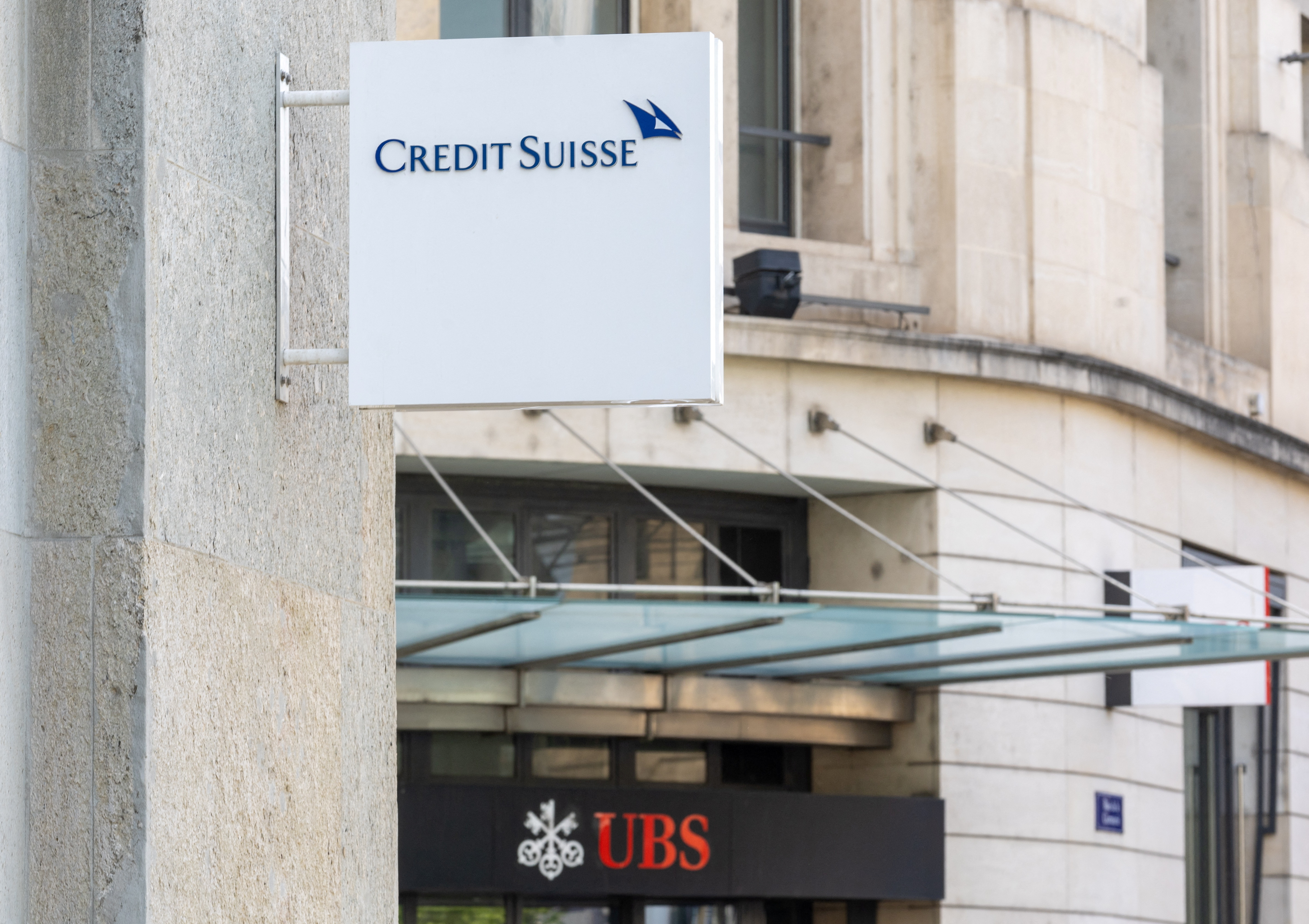 The logos of Swiss bank Credit Suisse and UBS are seen in Geneva