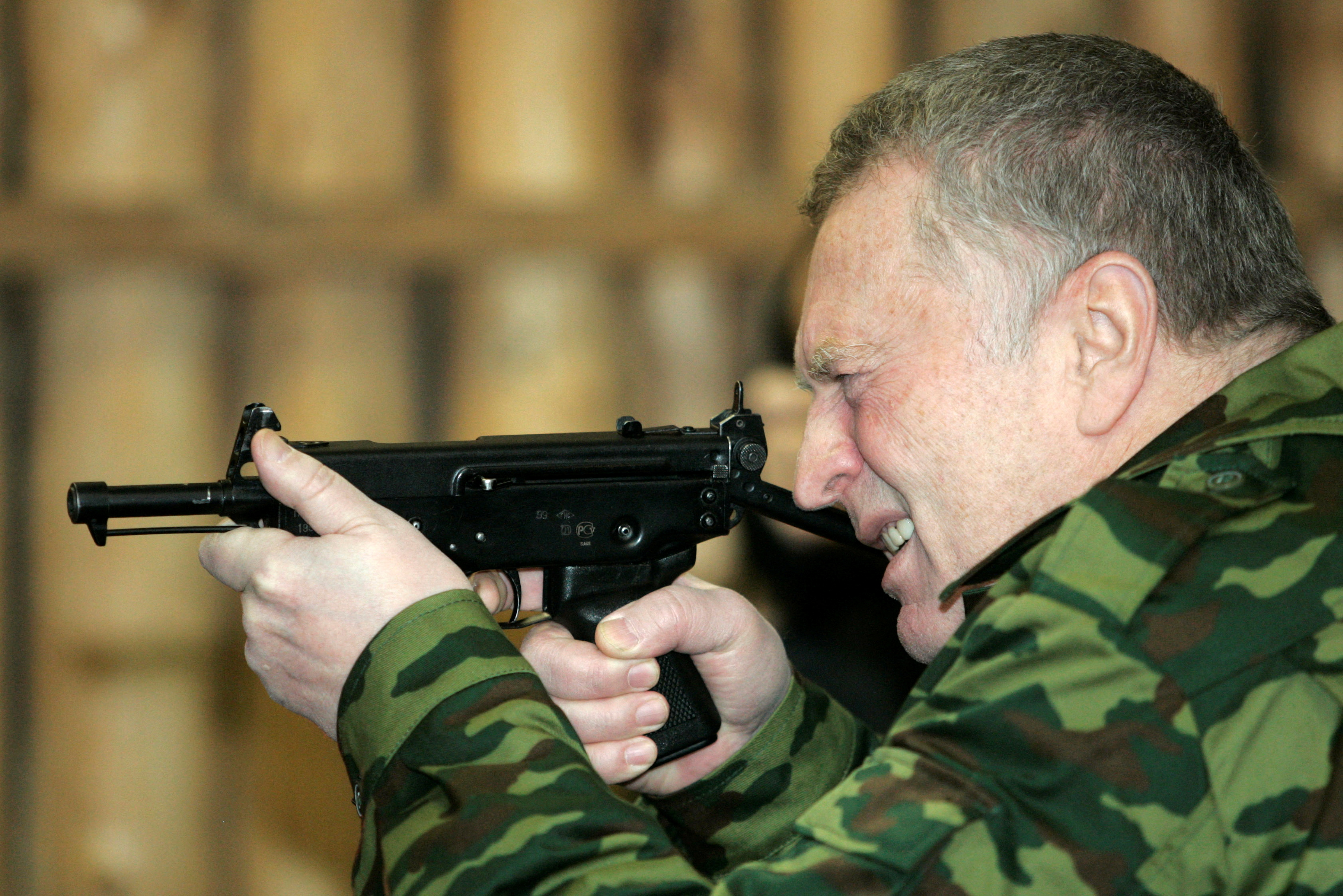 Leader of the nationalist LDPR party and presidential candidate Zhirinovsky takes aim at a shooting range in Chernogolovka