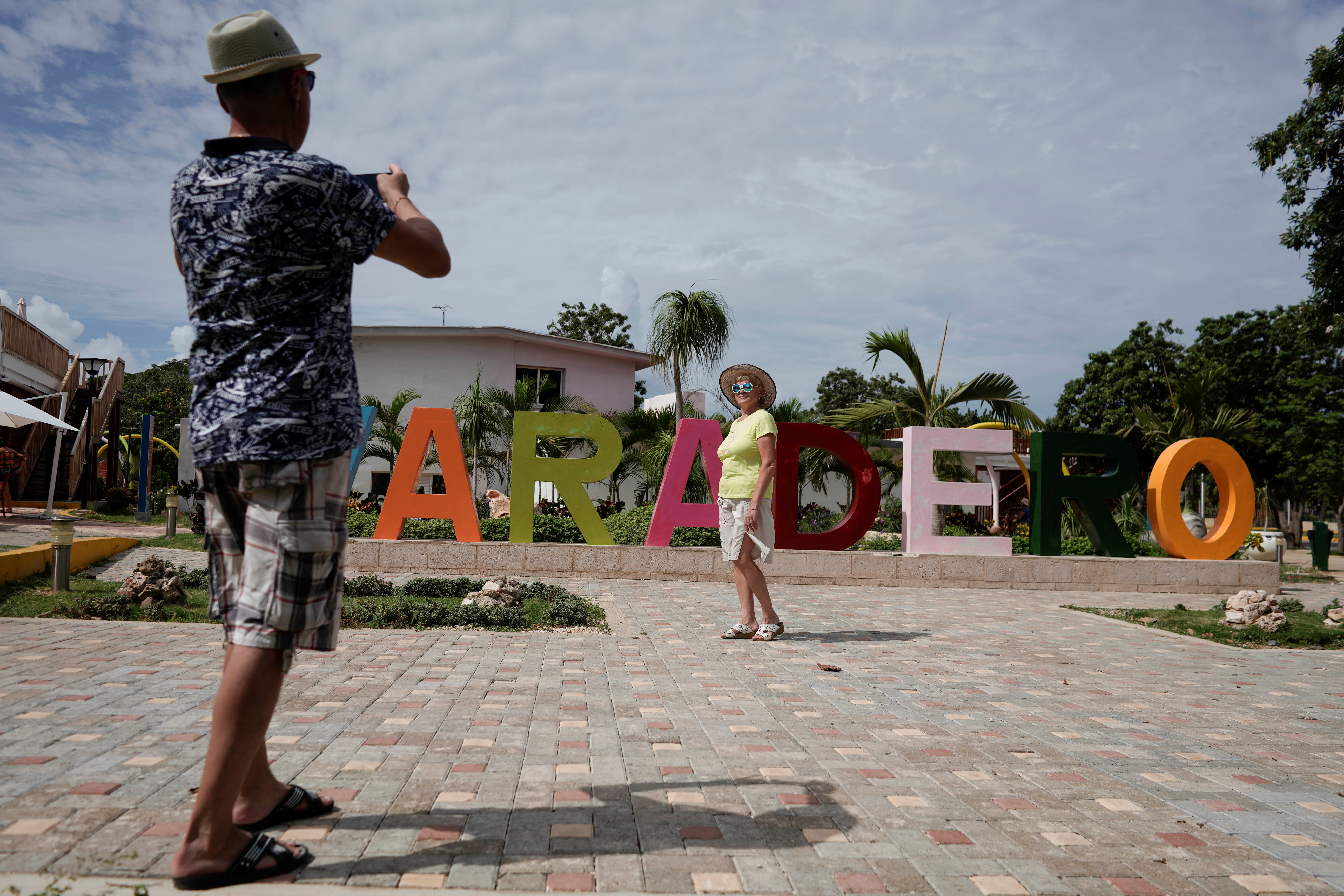 Tourists take pictures amid concerns about the spread of the coronavirus disease (COVID-19) in Varadero, Cuba, October 22, 2021. Picture taken on October 22, 2021. REUTERS/Alexandre Meneghini