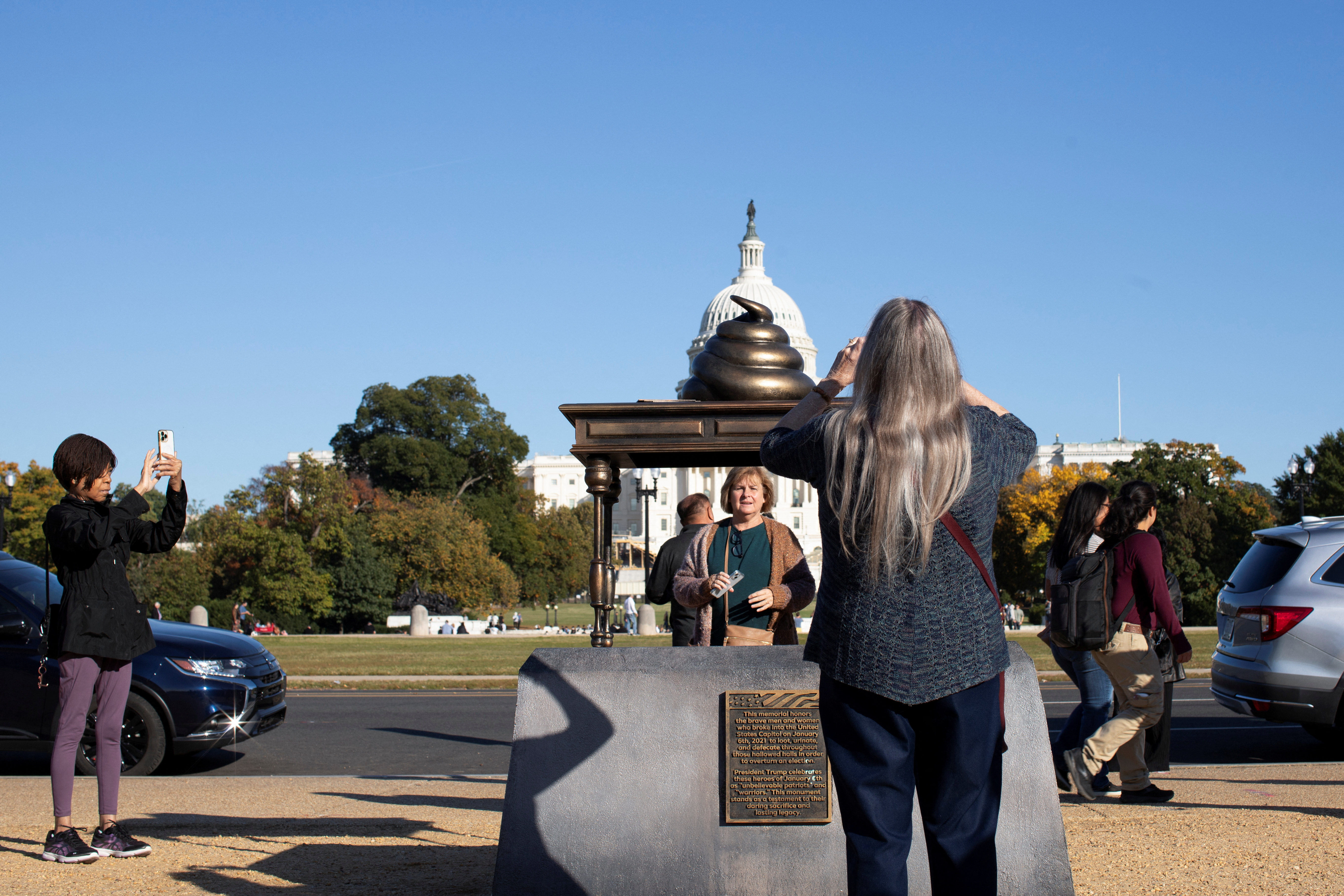 Poop-emoji statue near US Capitol evokes stain of Jan. 6 riot | Reuters, image size:5448x3632