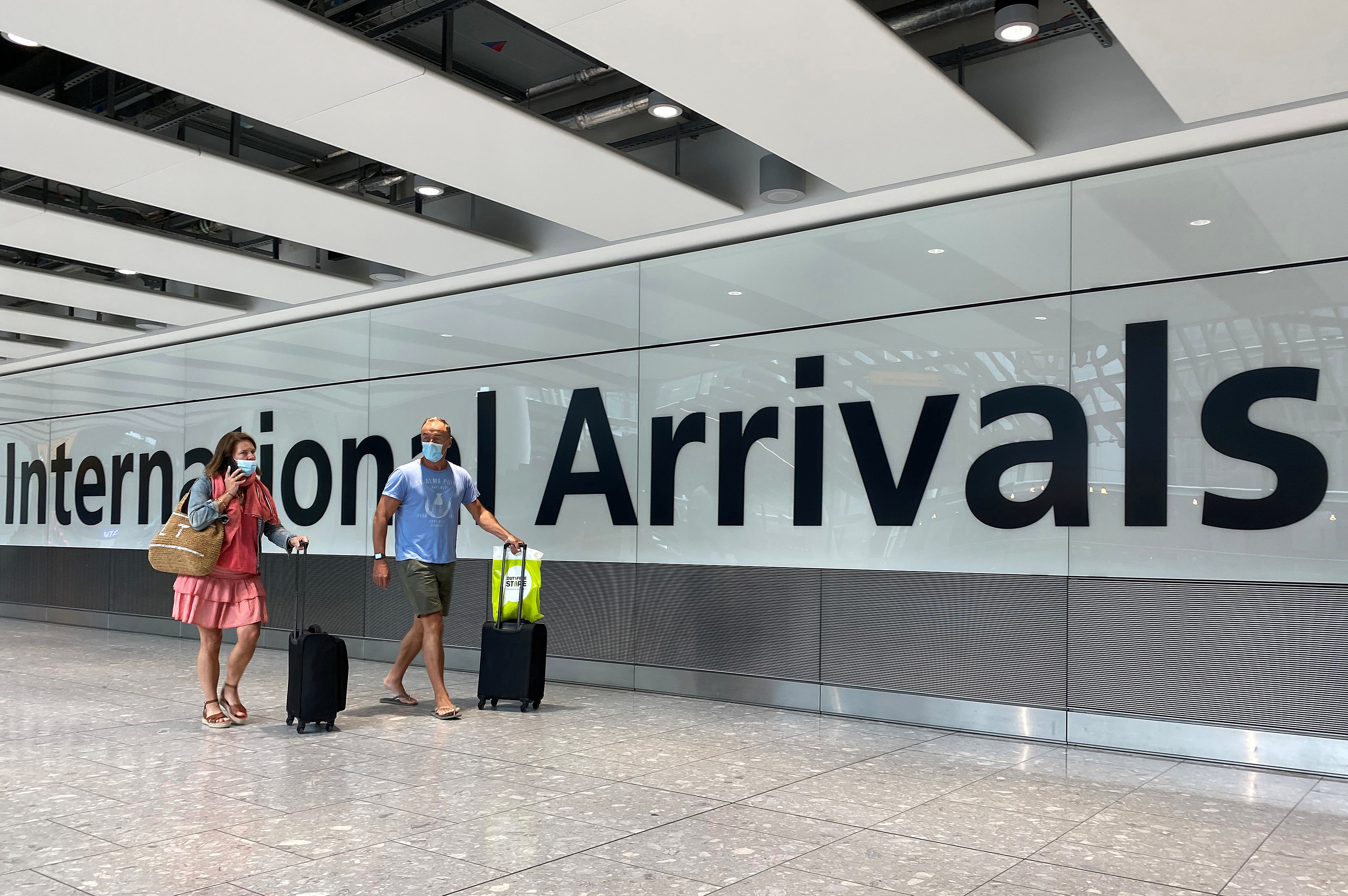 Passengers from international flights arrive at Heathrow Airport, following the outbreak of the coronavirus disease (COVID-19), London, Britain