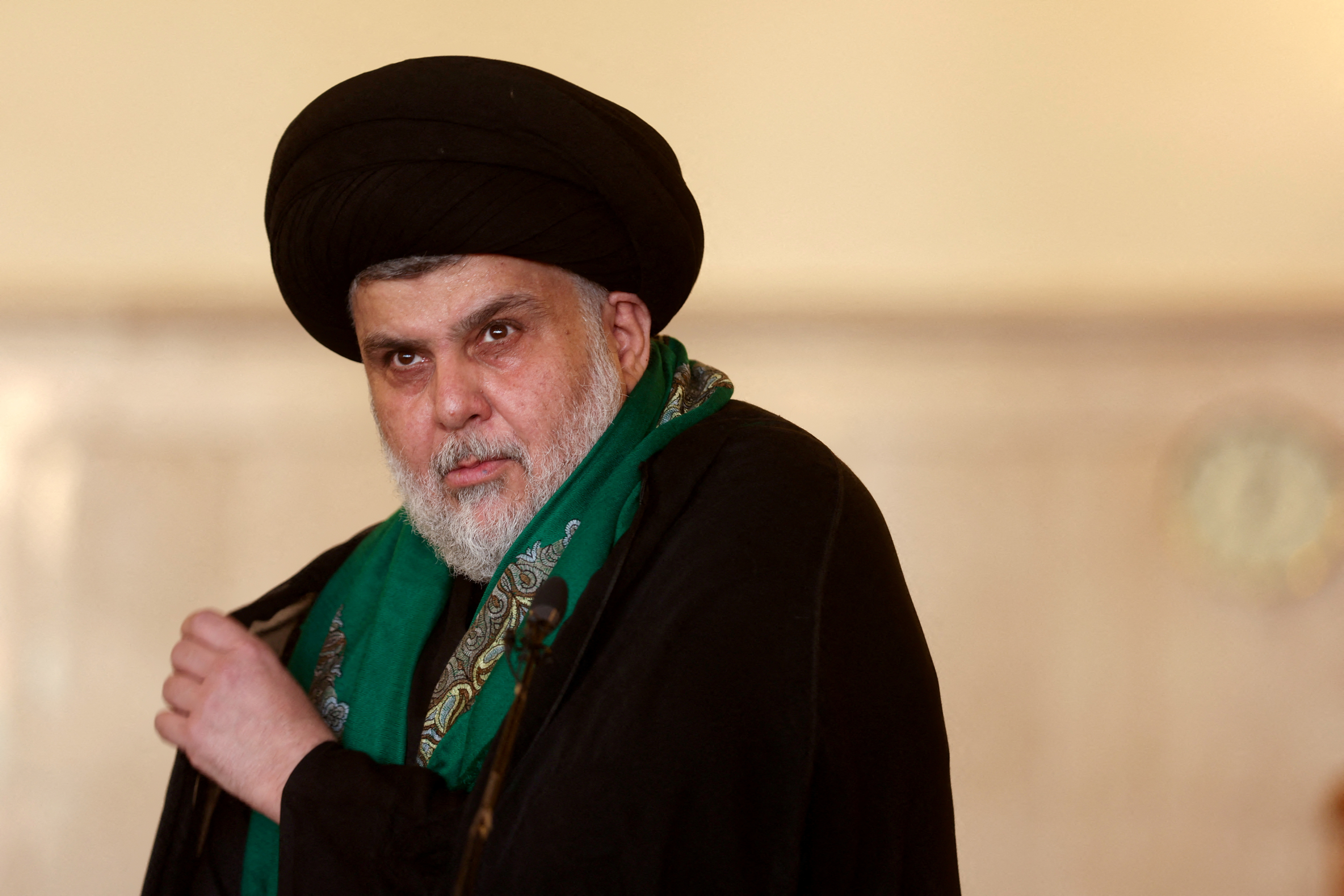 Iraqi Shi'ite cleric Muqtada al-Sadr delivers a sermon to worshippers at the Kufa mosque near Najaf