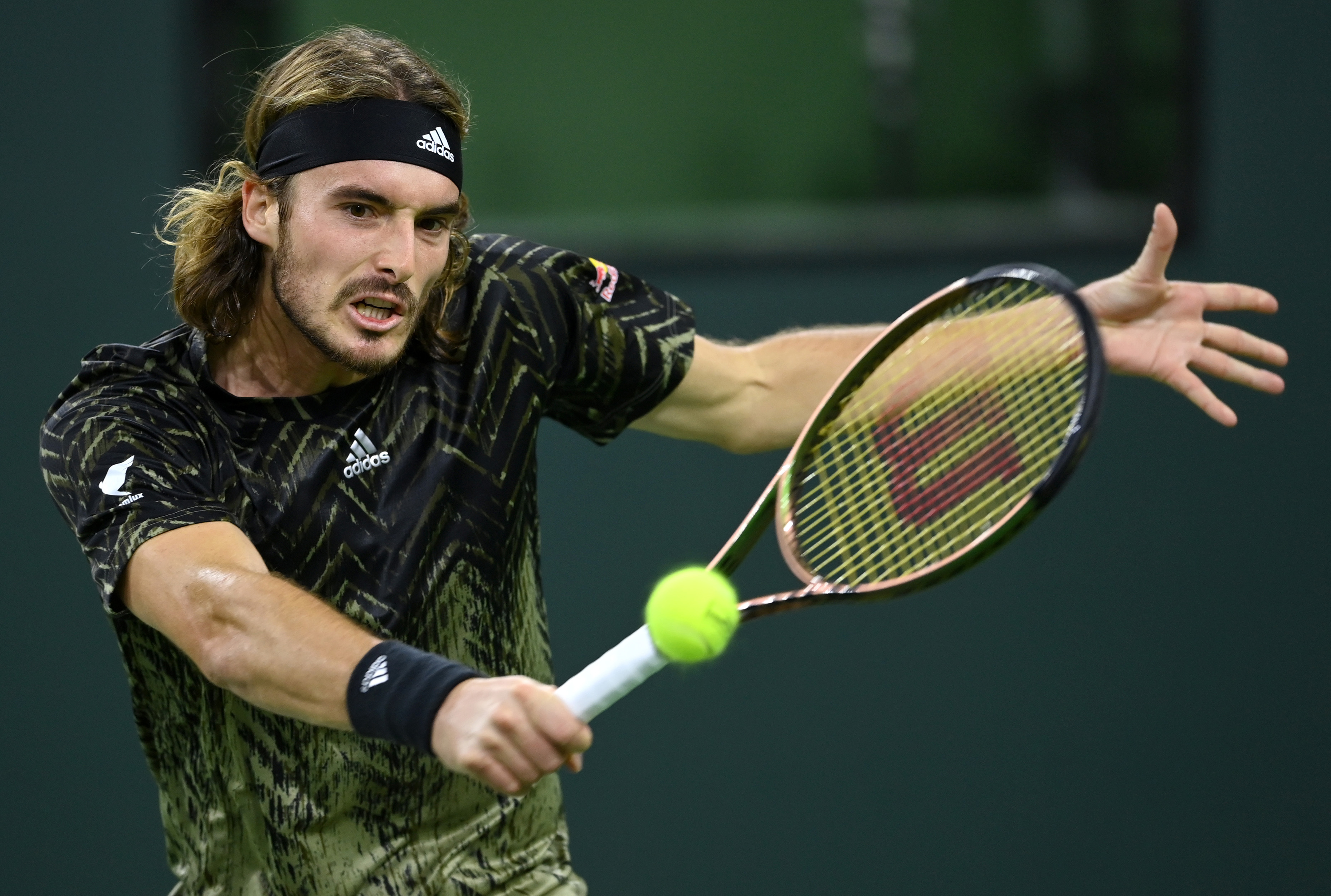 Oct 12, 2021; Indian Wells, CA, USA; Stefanos Tsitsipas (GRE) hits a shot against Fabio Fognini (ITA) during a third round match in the BNP Paribas Open at the Indian Wells Tennis Garden. Mandatory Credit: Jayne Kamin-Oncea-USA TODAY Sports