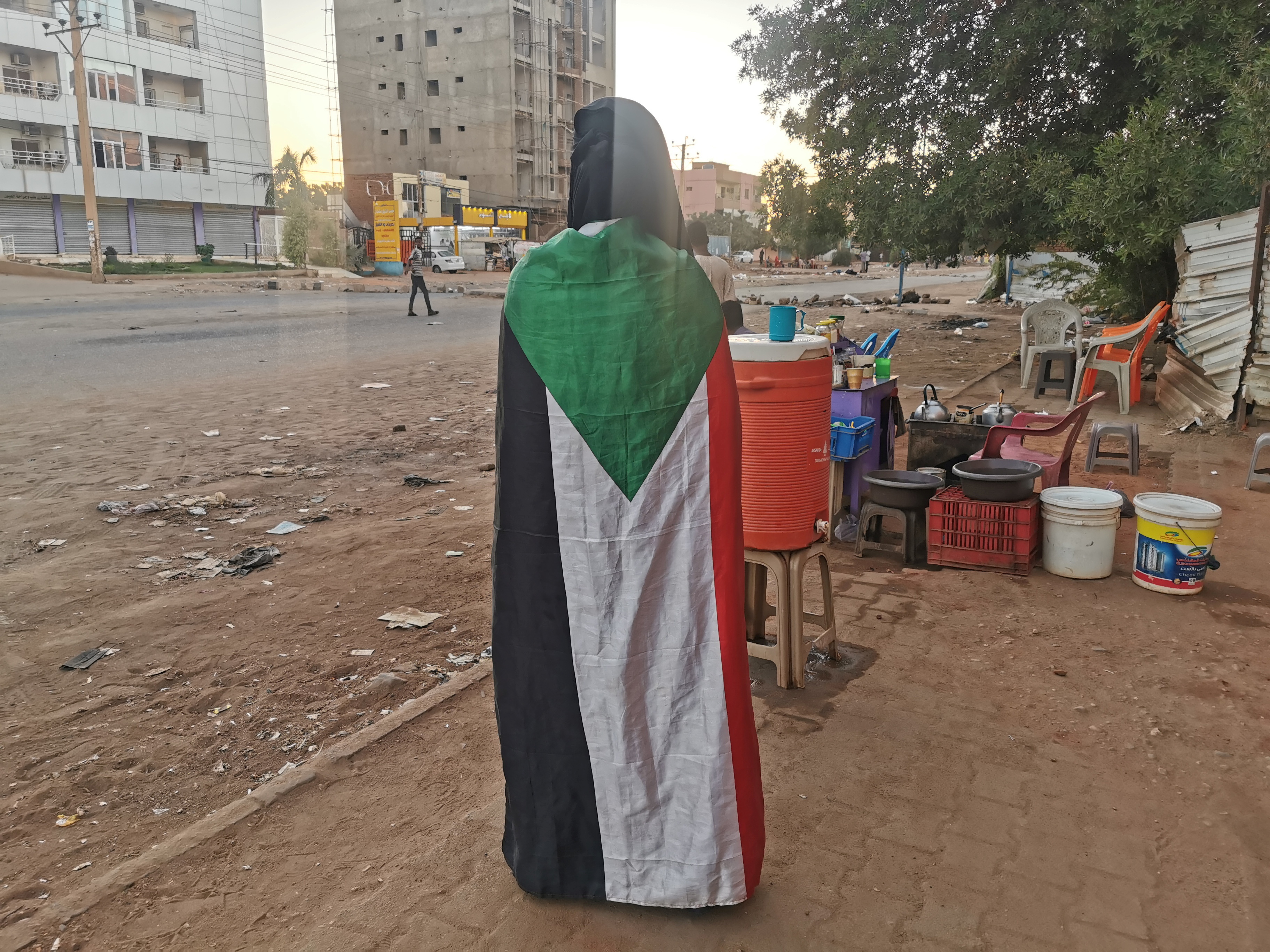 A person wears a Sudanese flag during a protest, in Khartoum, Sudan, November 25, 2021. REUTERS/El Tayeb Siddig