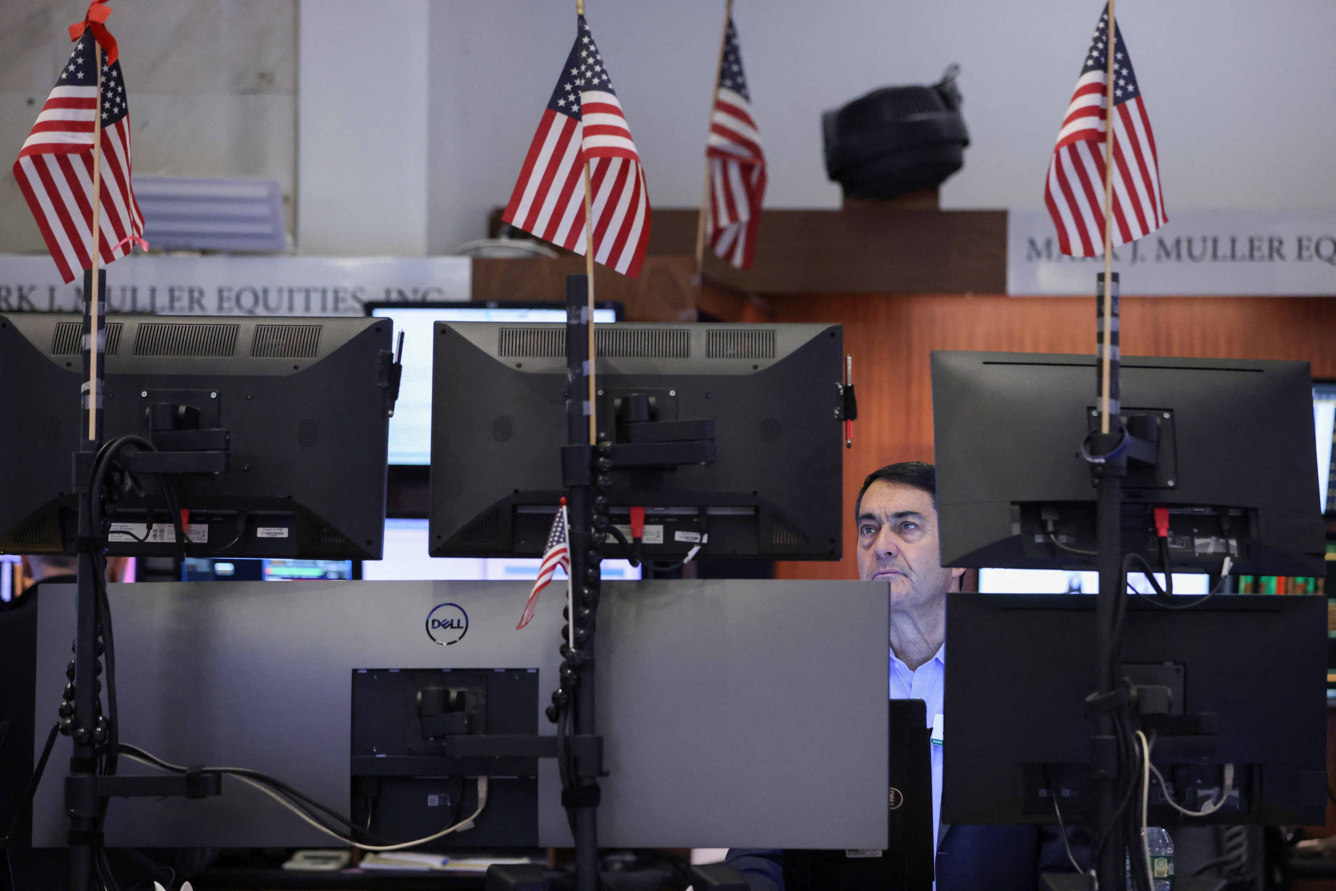 A trader works on the trading floor at the New York Stock Exchange (NYSE) in New York City