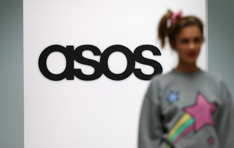 A model walks on an in-house catwalk at ASOS offices in London
