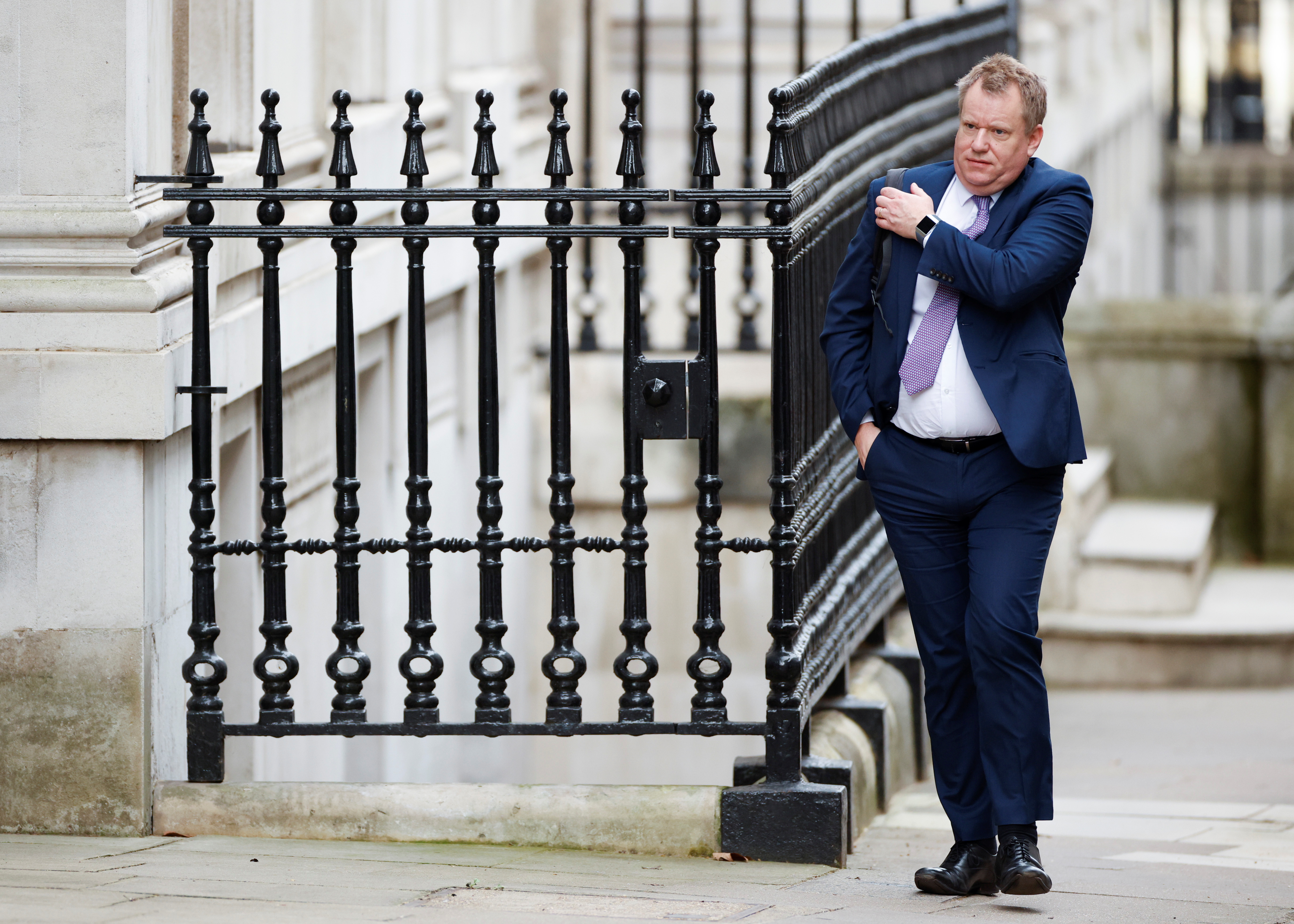 David Frost walks outside Downing Street in London