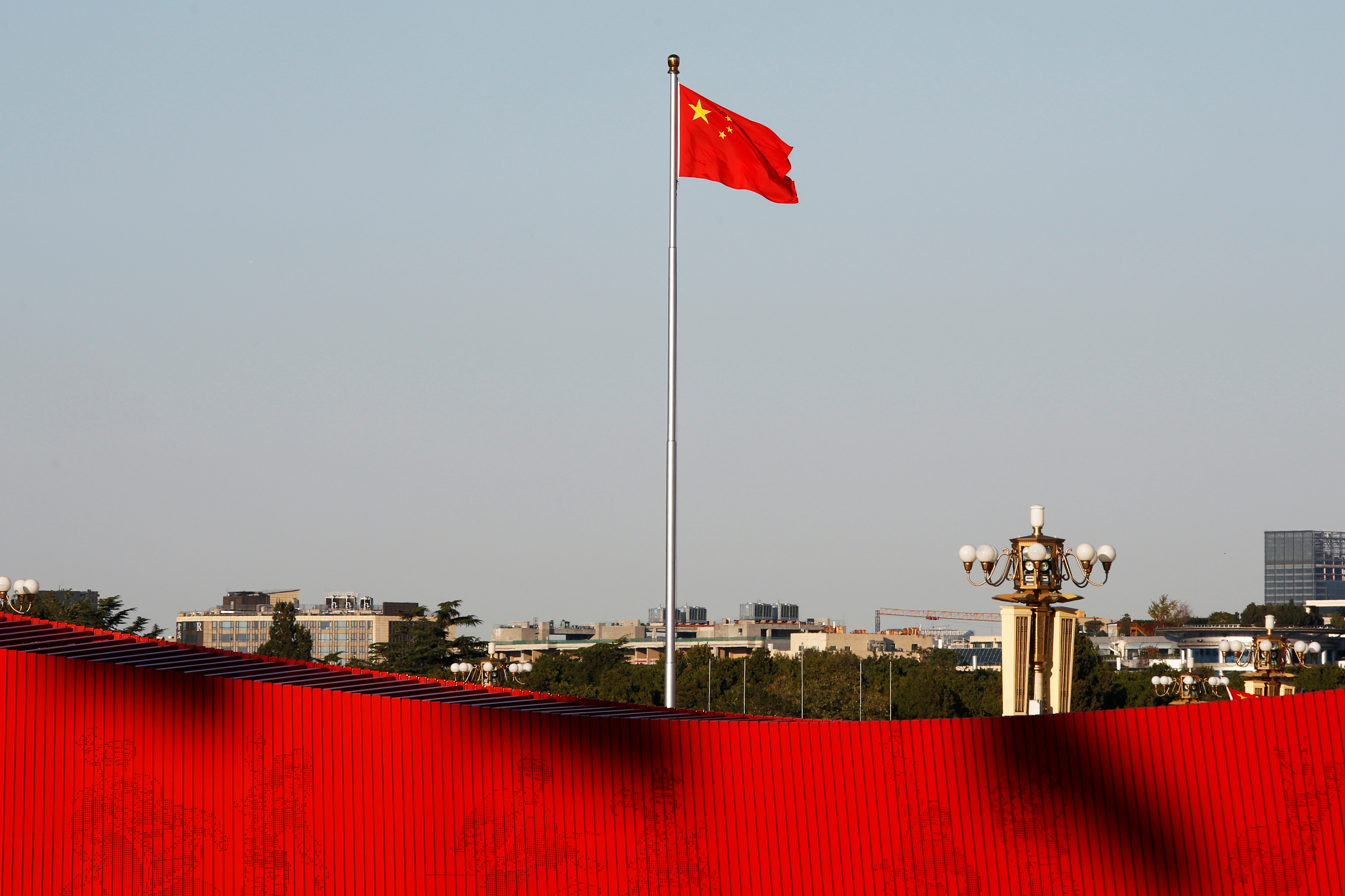 A Chinese flag flutters at the Tiananmen Square in Beijing, China October 25, 2019.  REUTERS/Florence Lo