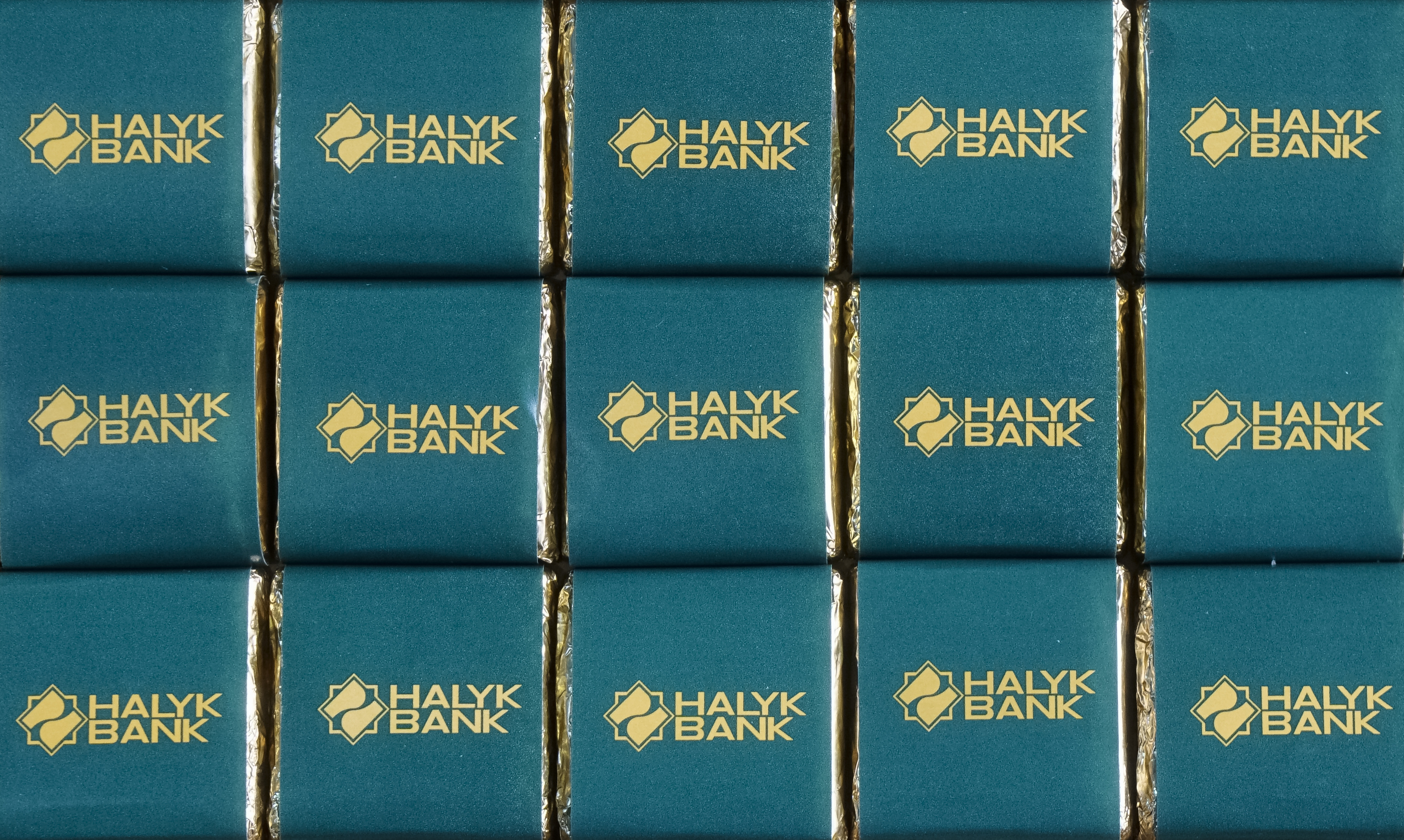 The logo of Halyk Bank is seen on the wrapping of promotional chocolate bars in Almaty
