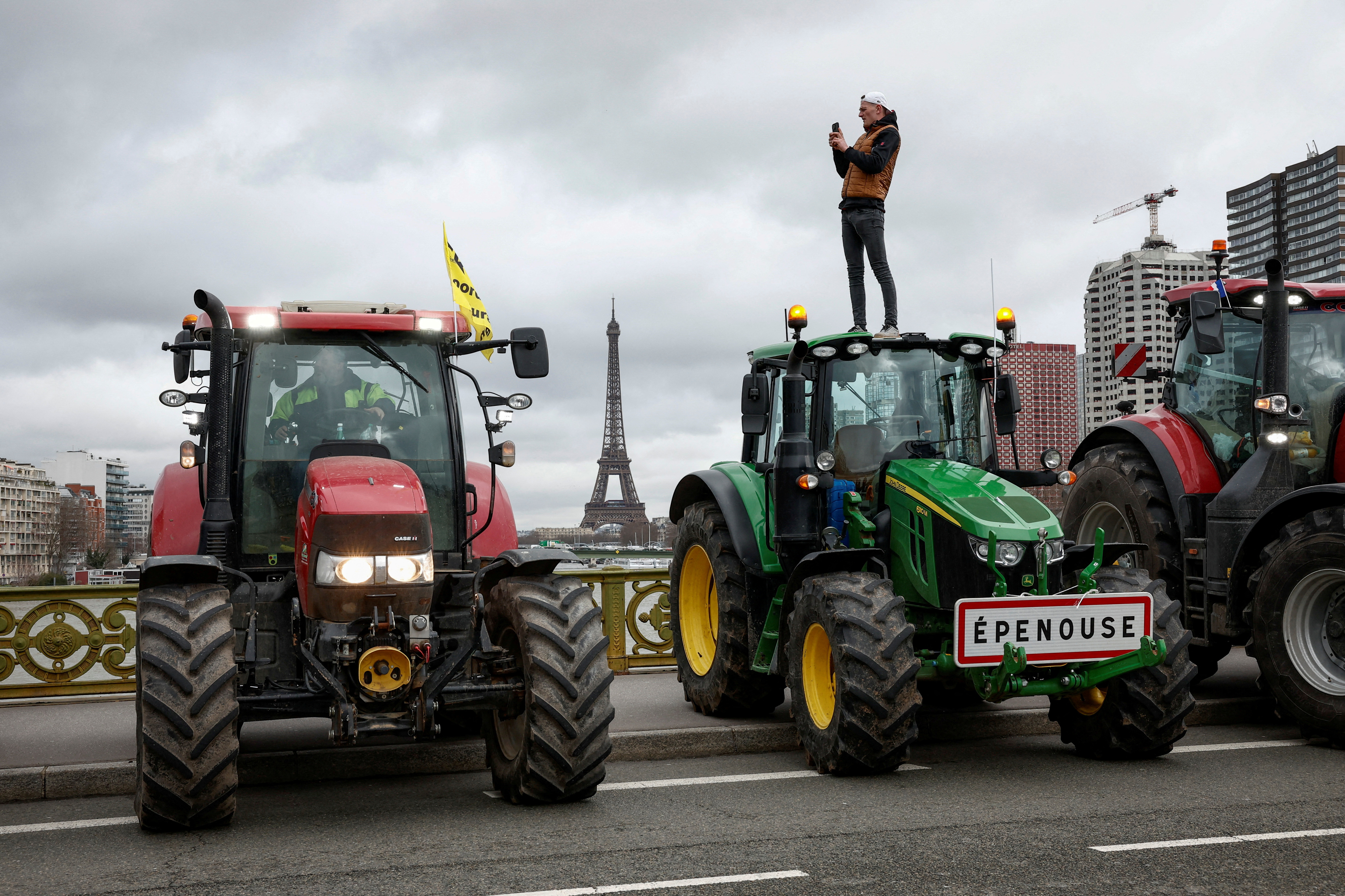 Farmers protest ahead of the opening of the Paris farm show, in Paris