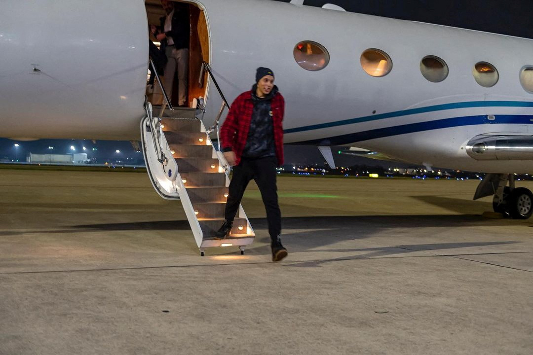 U.S. basketball star Griner steps off a plane after her release from Russia