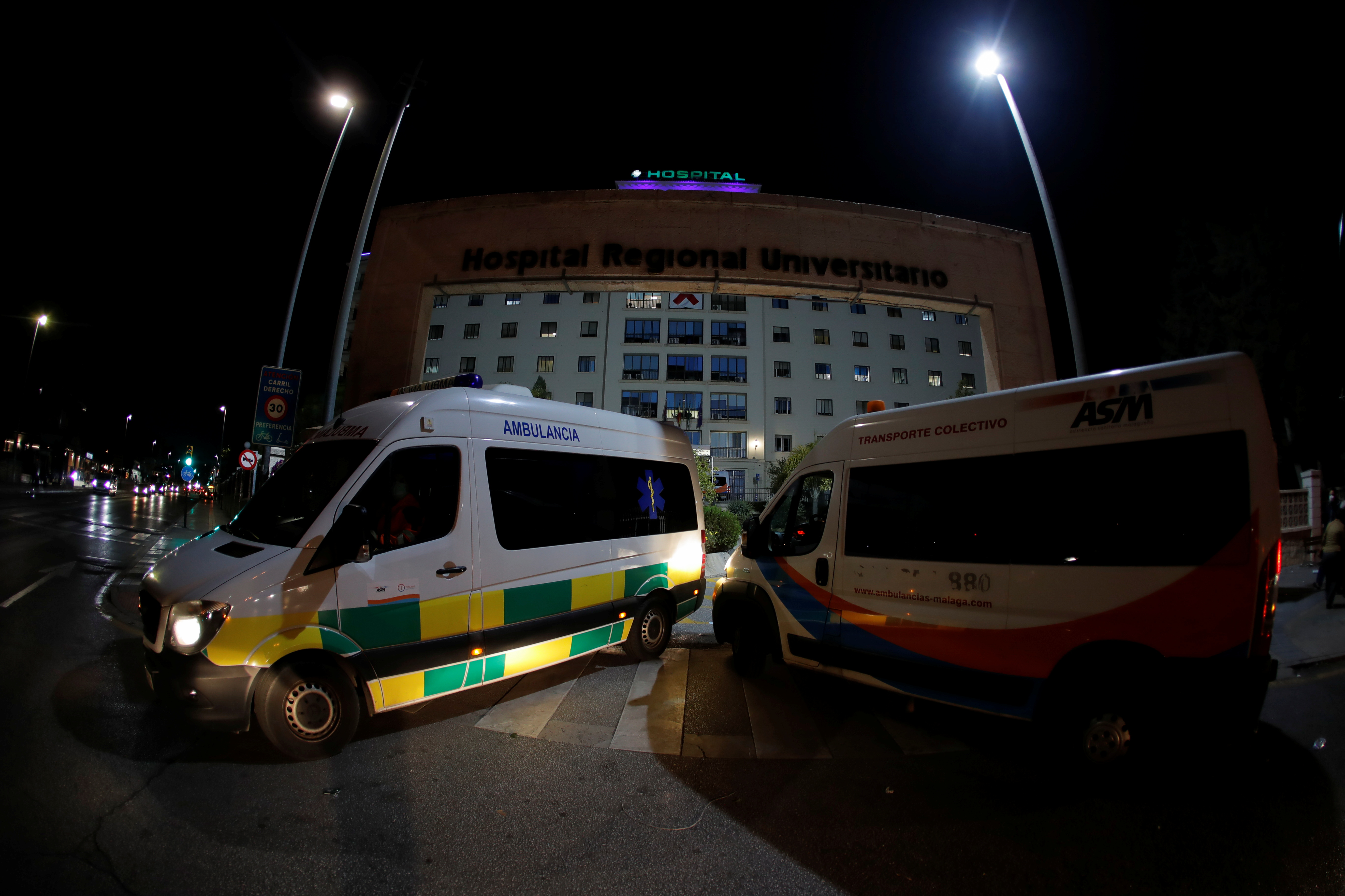 Ambulances drive at the front entrance of the Malaga Regional University Hospital