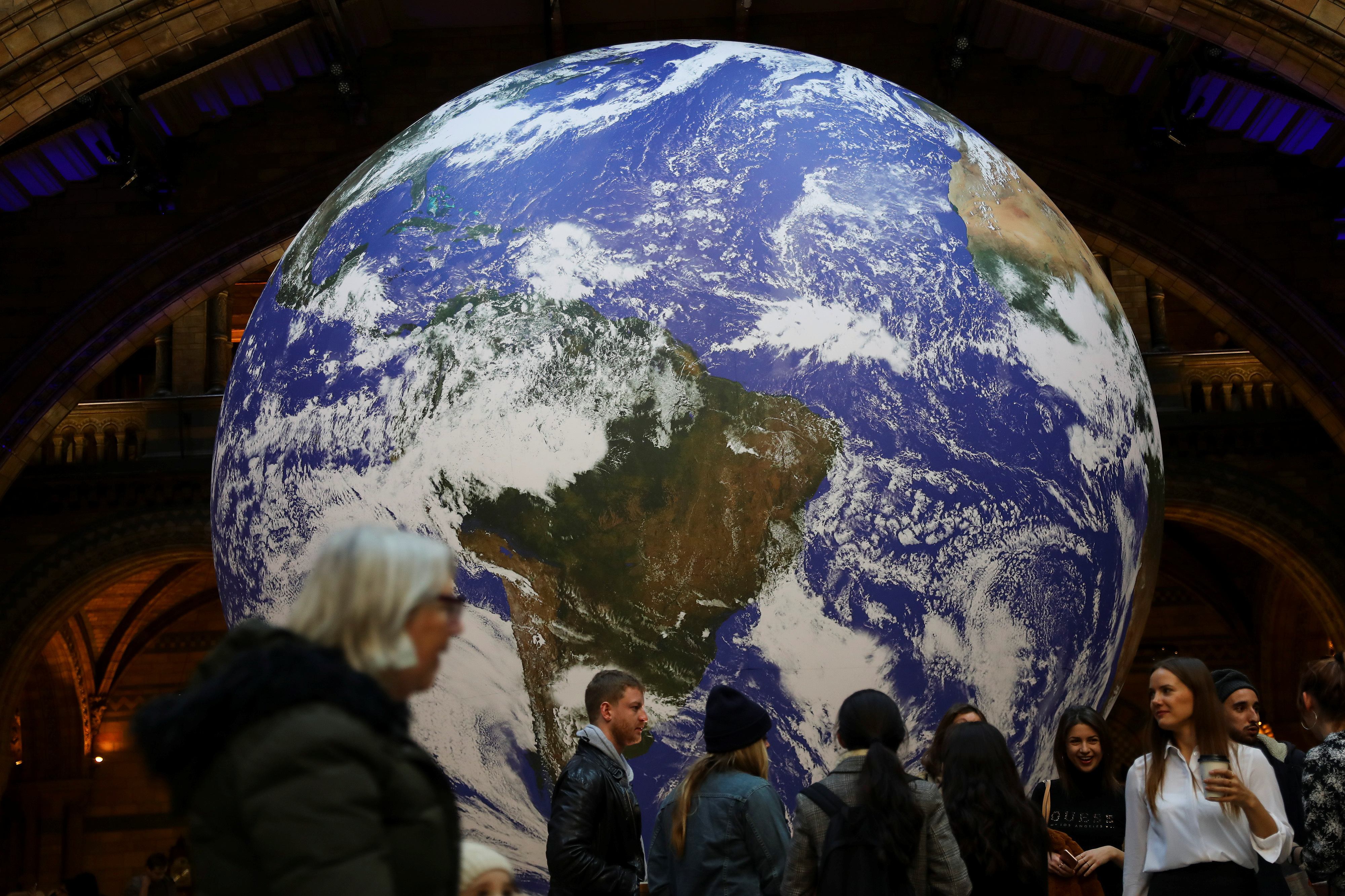 A giant Earth artwork is displayed in the Hintze Hall inside the Natural History Museum in London