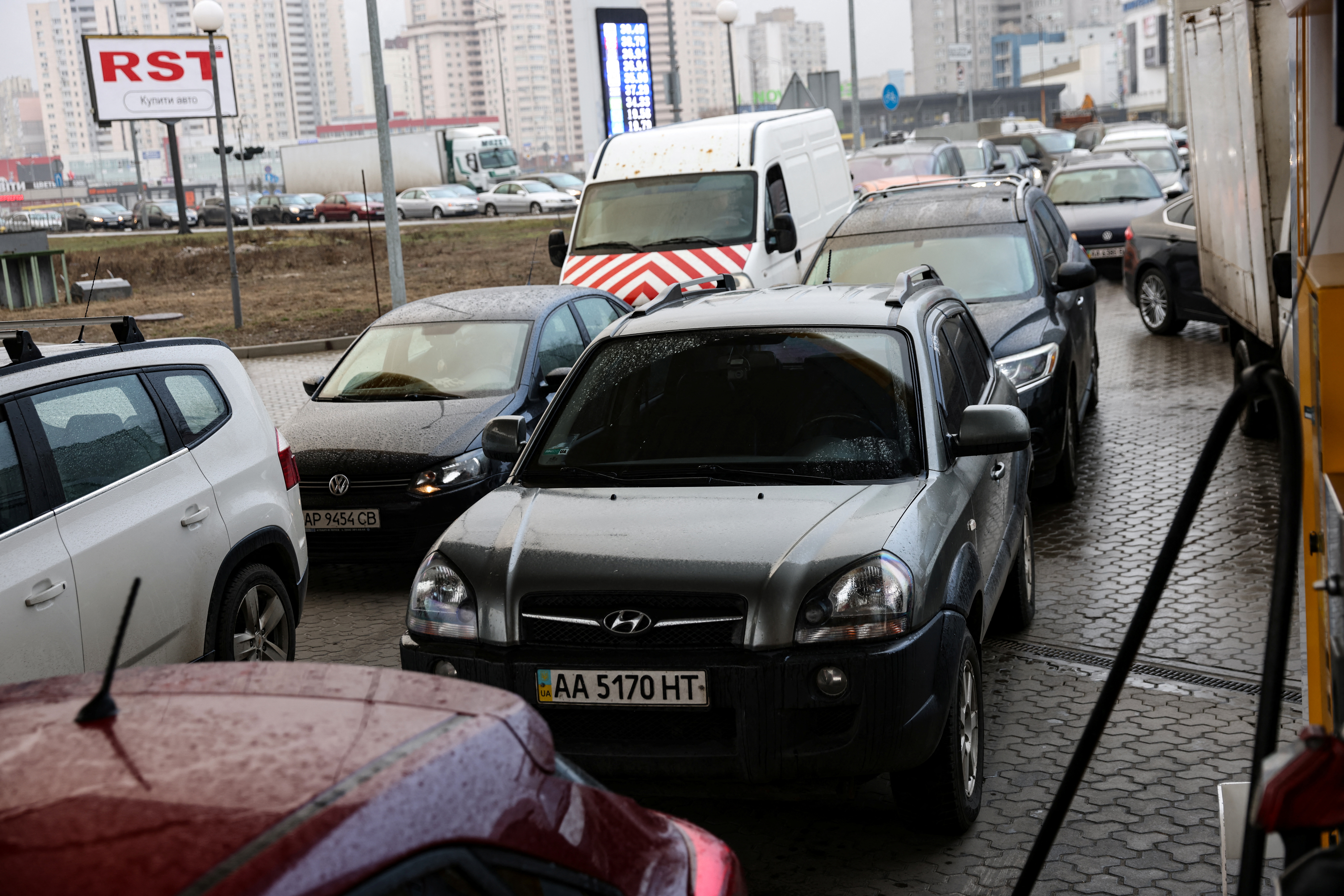 Cars queue at a gas station in Kyiv