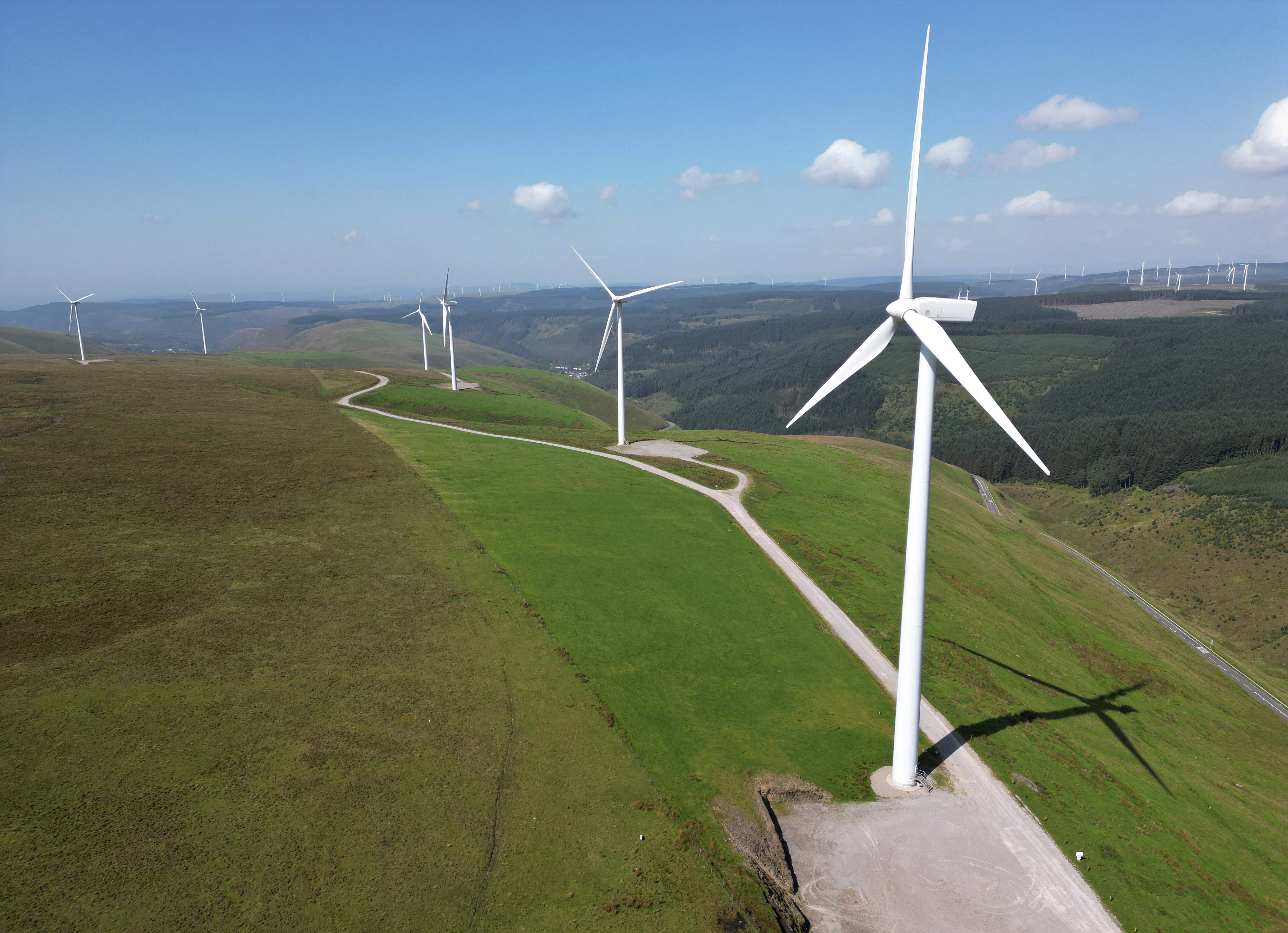 Wind turbines are seen at Llynfi Afan Wind Farm near Port Talbot in South Wales