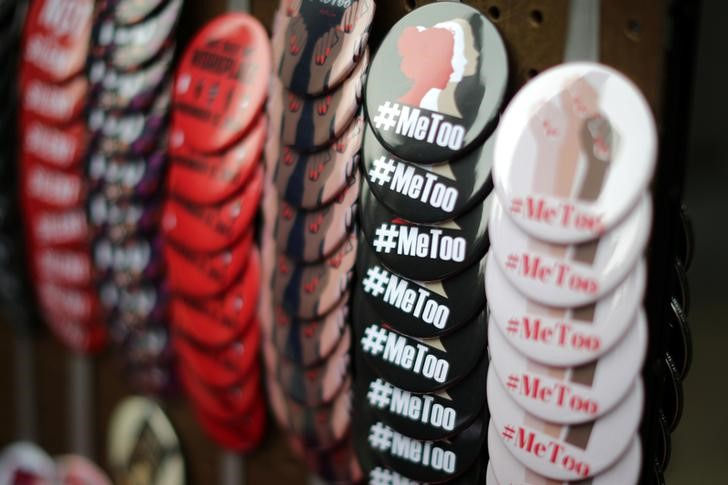 A vendor sells #MeToo badges a protest march for survivors of sexual assault and their supporters in Hollywood, Los Angeles