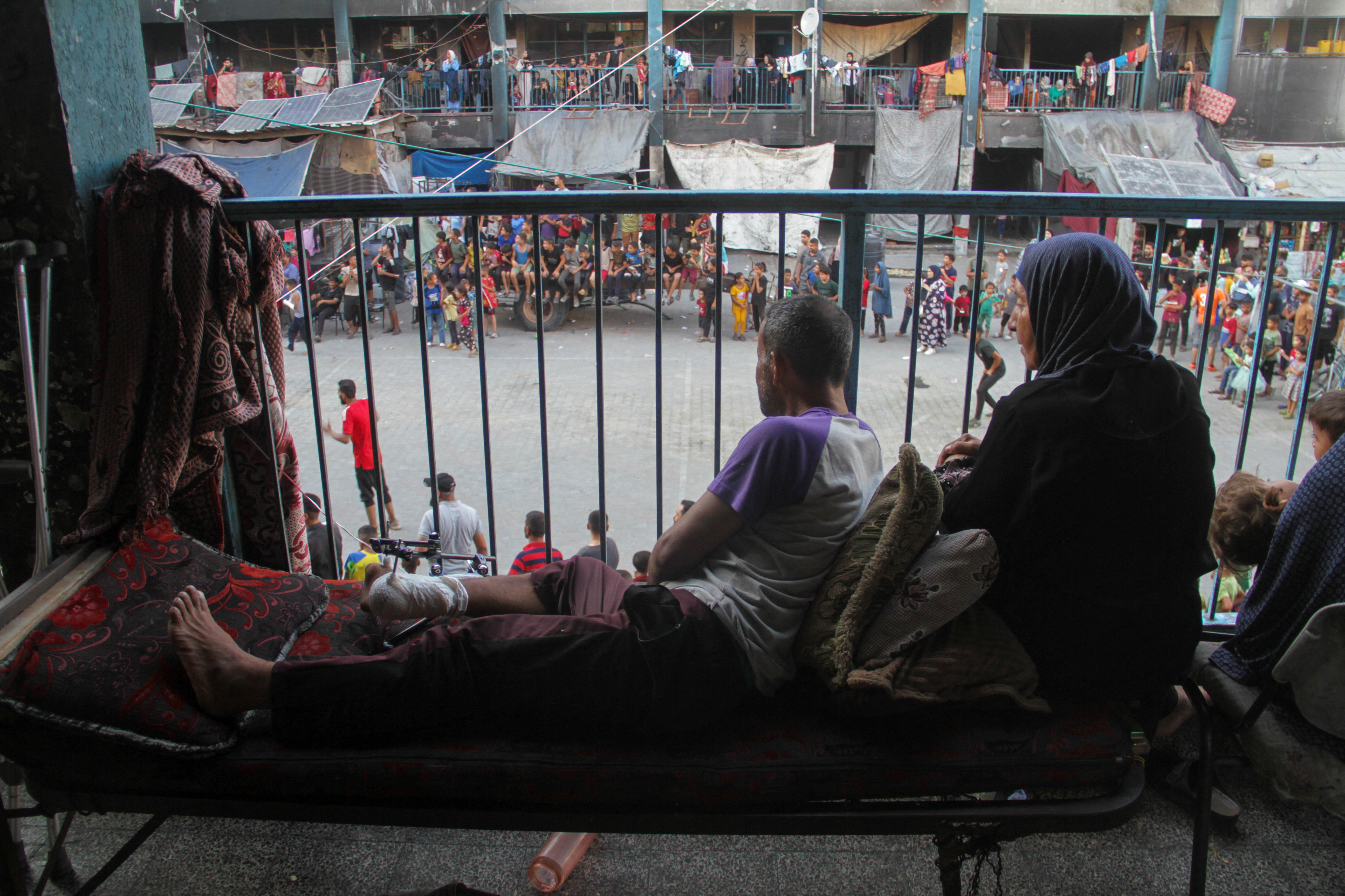 Displaced Palestinians watch a soccer match at an UNRWA shelter school, amid Israel-Hamas conflict, in Jabalia in the northern Gaza Strip