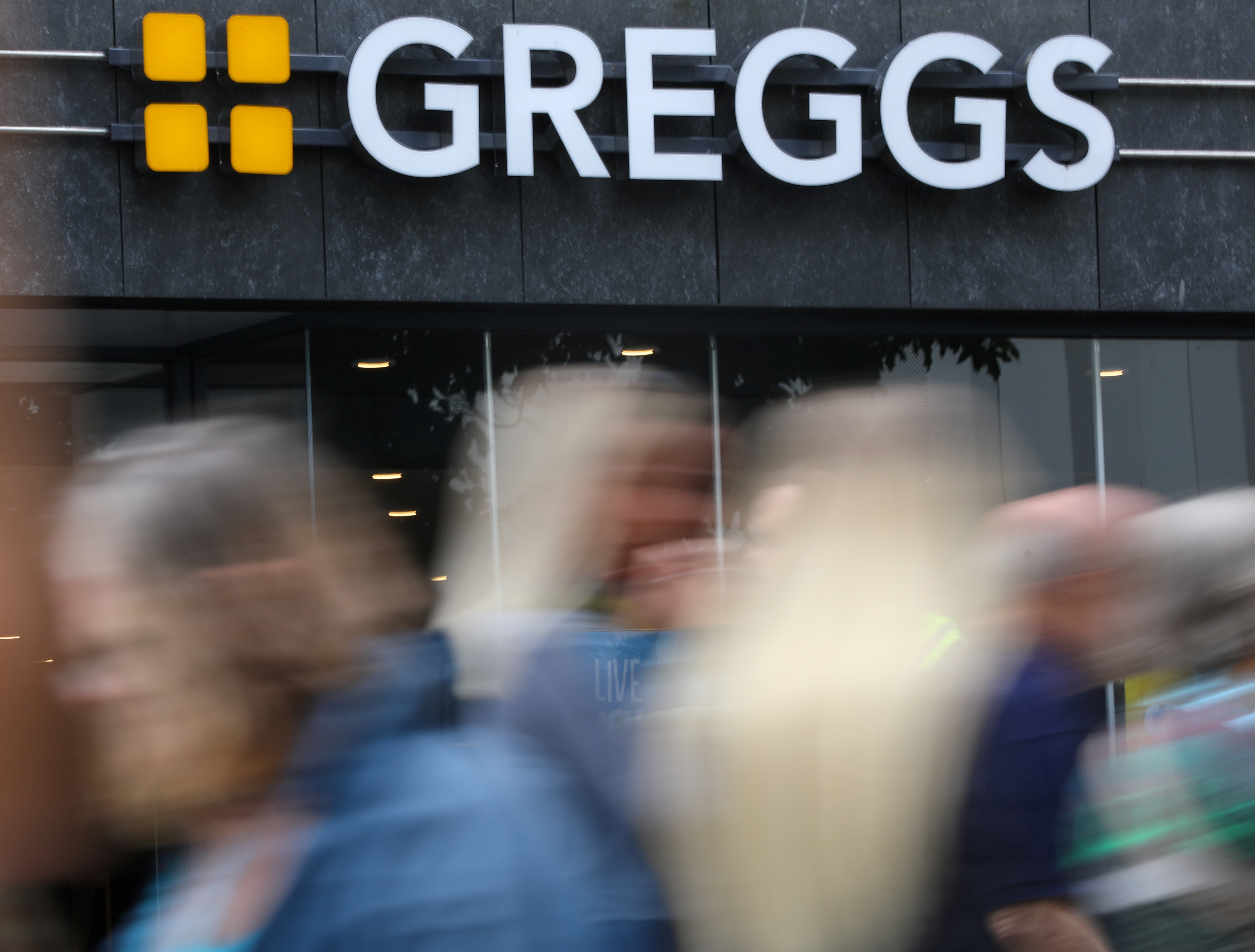 People walk past a branch of Greggs in Liverpool