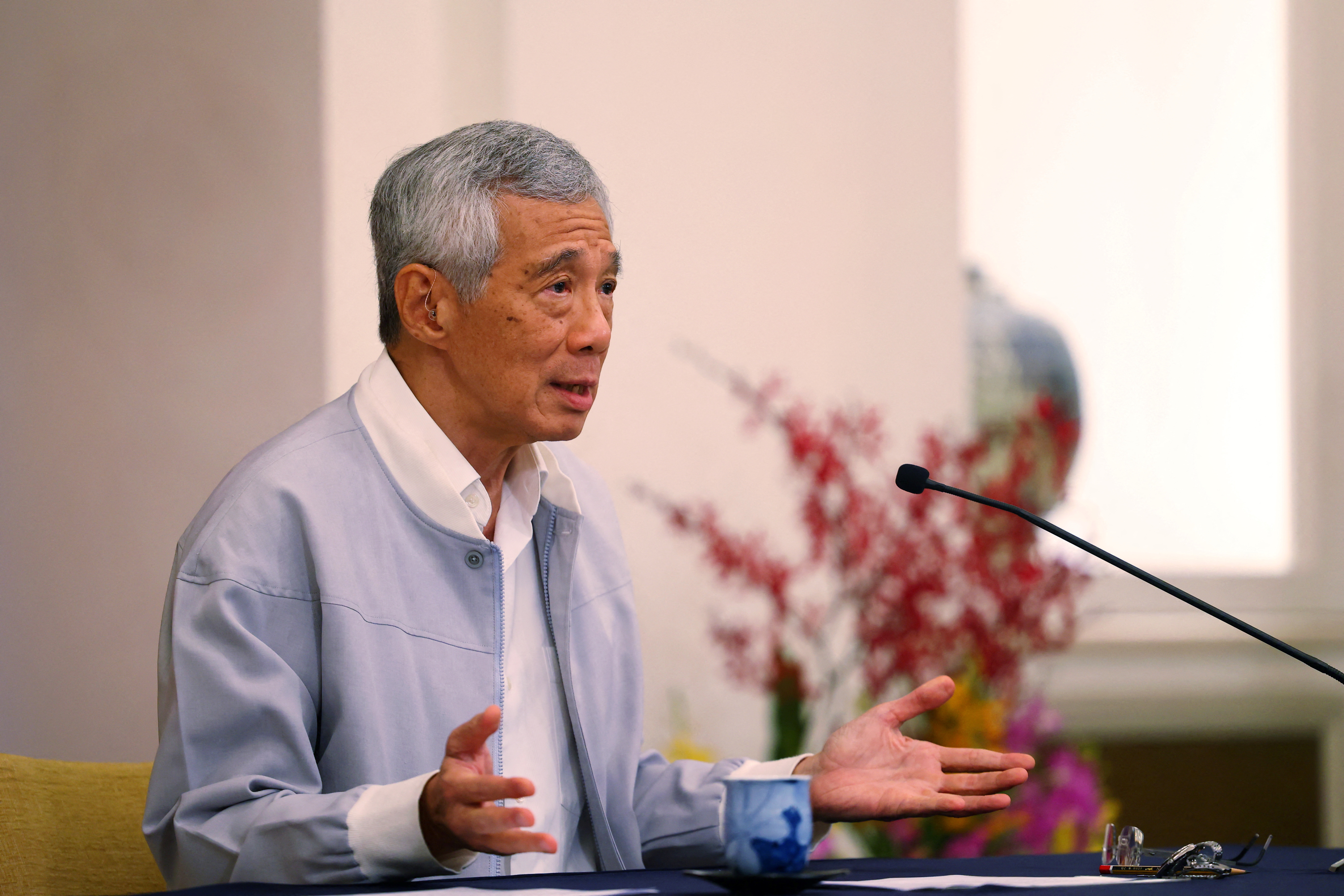 Singapore's Prime Minister Lee Hsien Loong speaks during a press conference after the resignation of two senior lawmakers, at the Istana