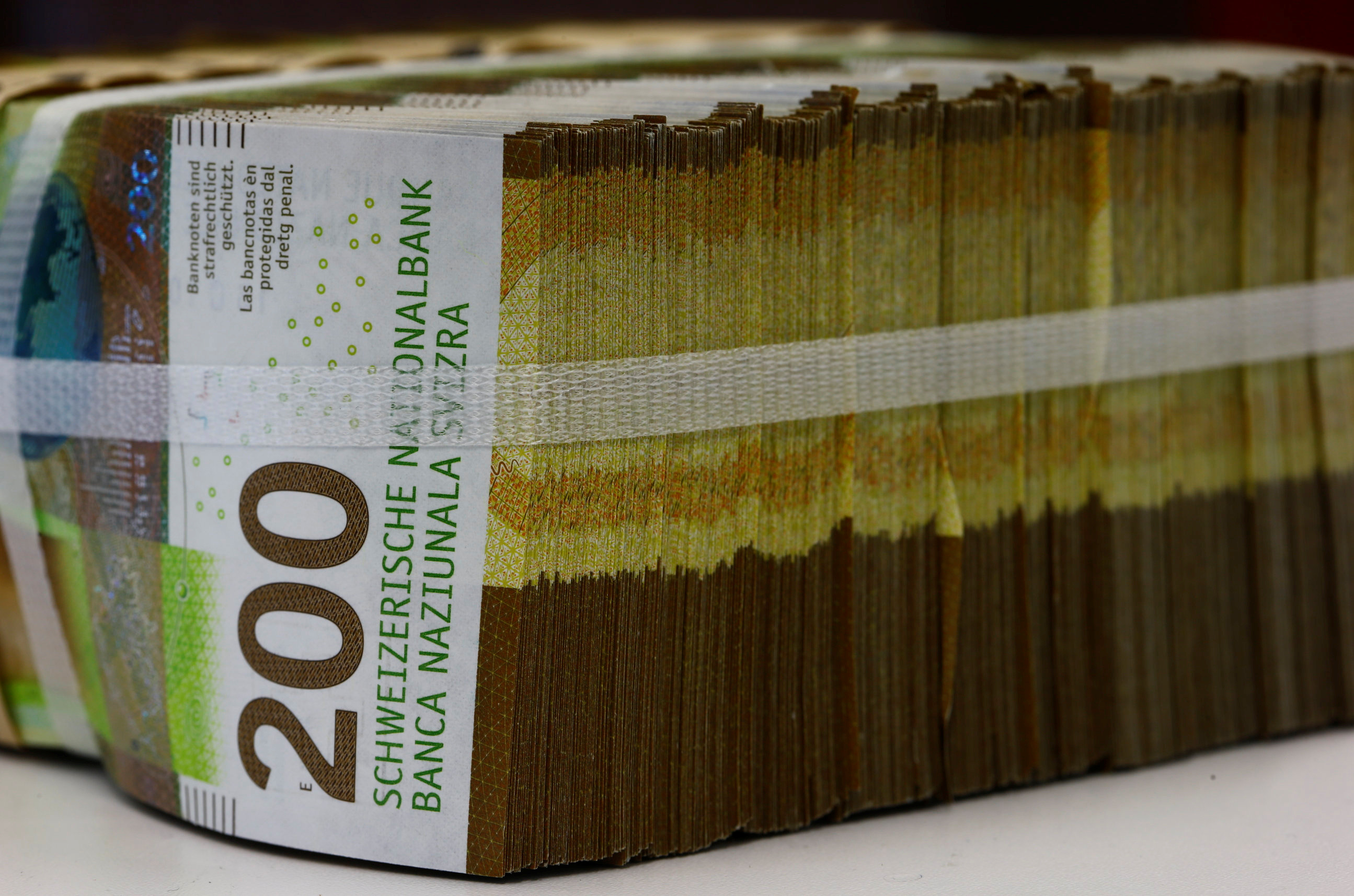 200-Swiss-franc banknotes are seen at a Swiss bank in Zurich