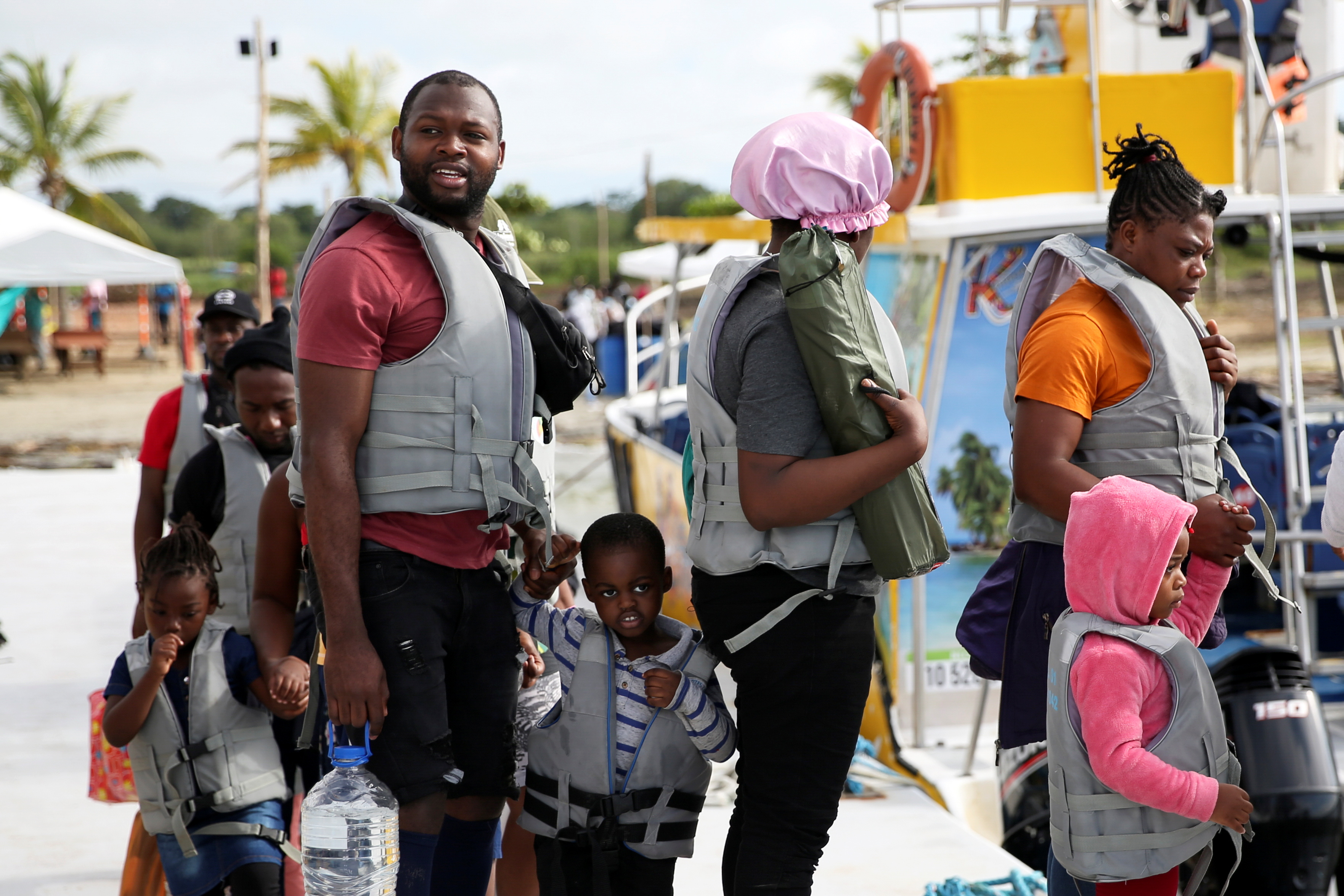 Migrants, mostly Haitians, wait to board boats bound for Acandi, Colombia, to later cross into Panama and continue north, in Necocli, Colombia, September 23, 2021.   REUTERS/Luisa Gonzalez