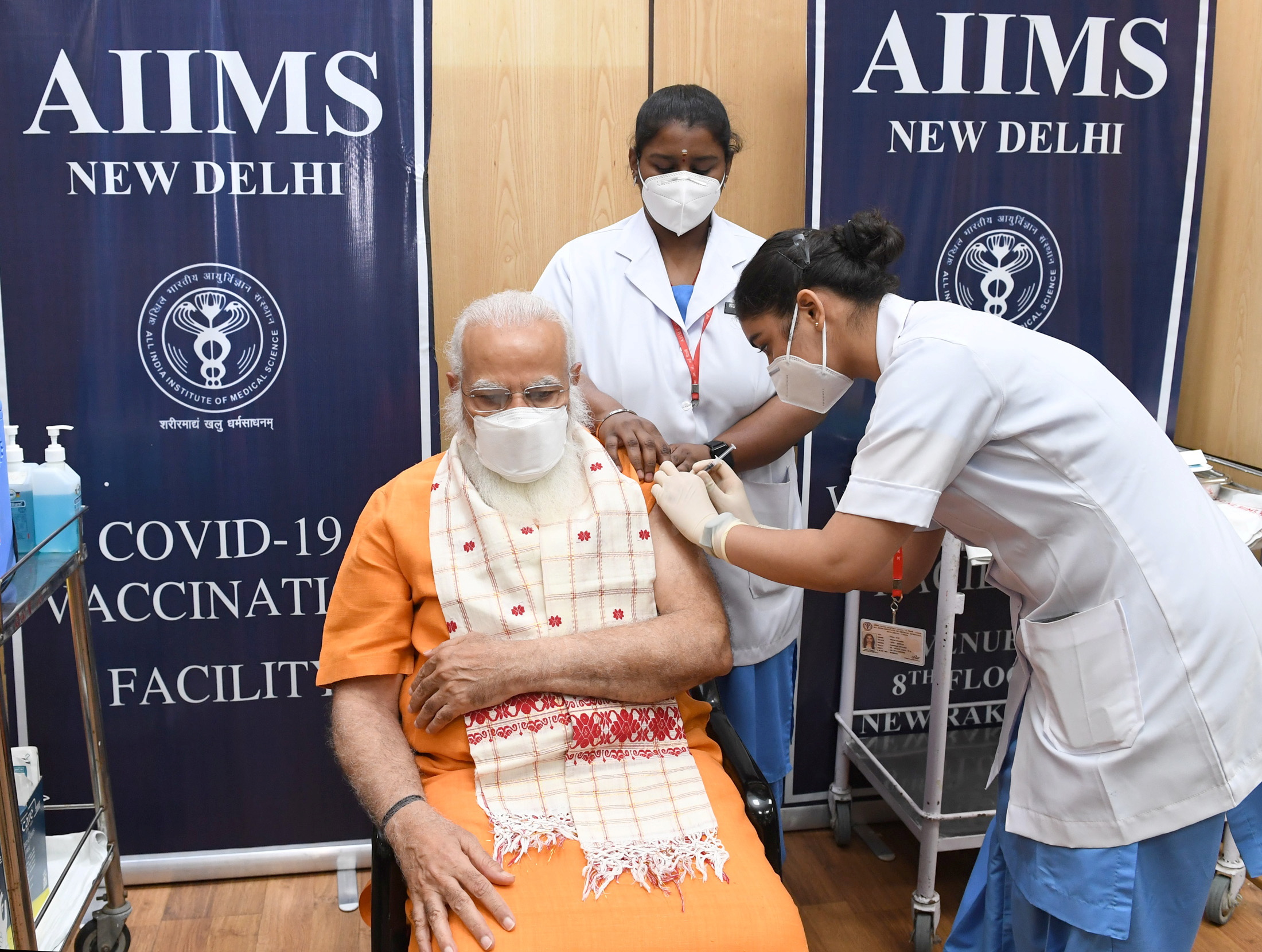 India's Prime Minister Narendra Modi receives his second dose of a coronavirus disease (COVID-19) vaccine at the All India Institute of Medical Sciences (AIIMS) hospital in New Delhi, India, April 8, 2021. India's Press Information Bureau/Handout via REUTERS