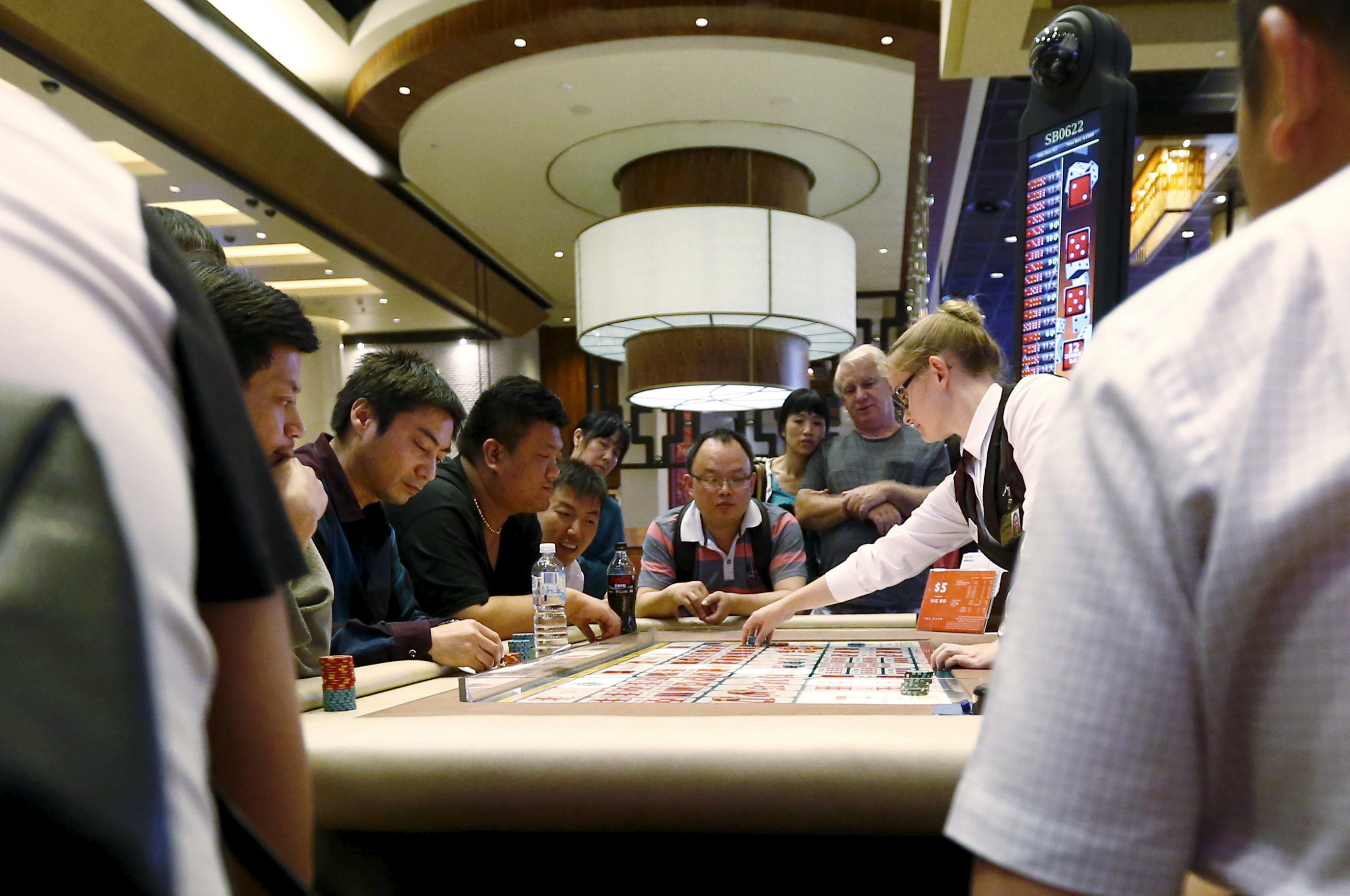 Visitors participate in a game at Sydney's Star Casino