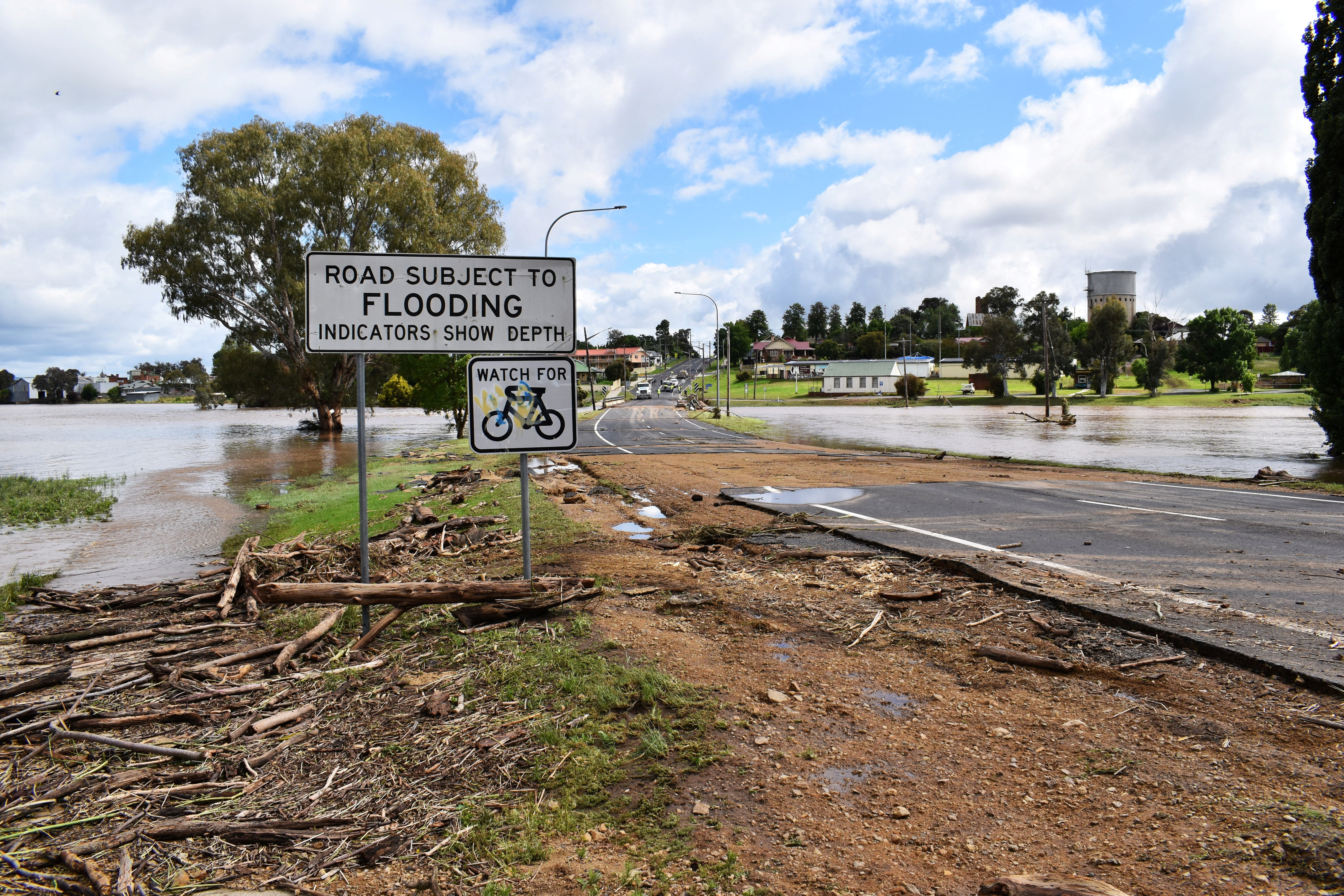 A damaged road is seen following flooding in the town of Canowindra, in the Central West region of New South Wales, Australia, November 15, 2022. AAP Image/Murray McCloskey via REUTERS