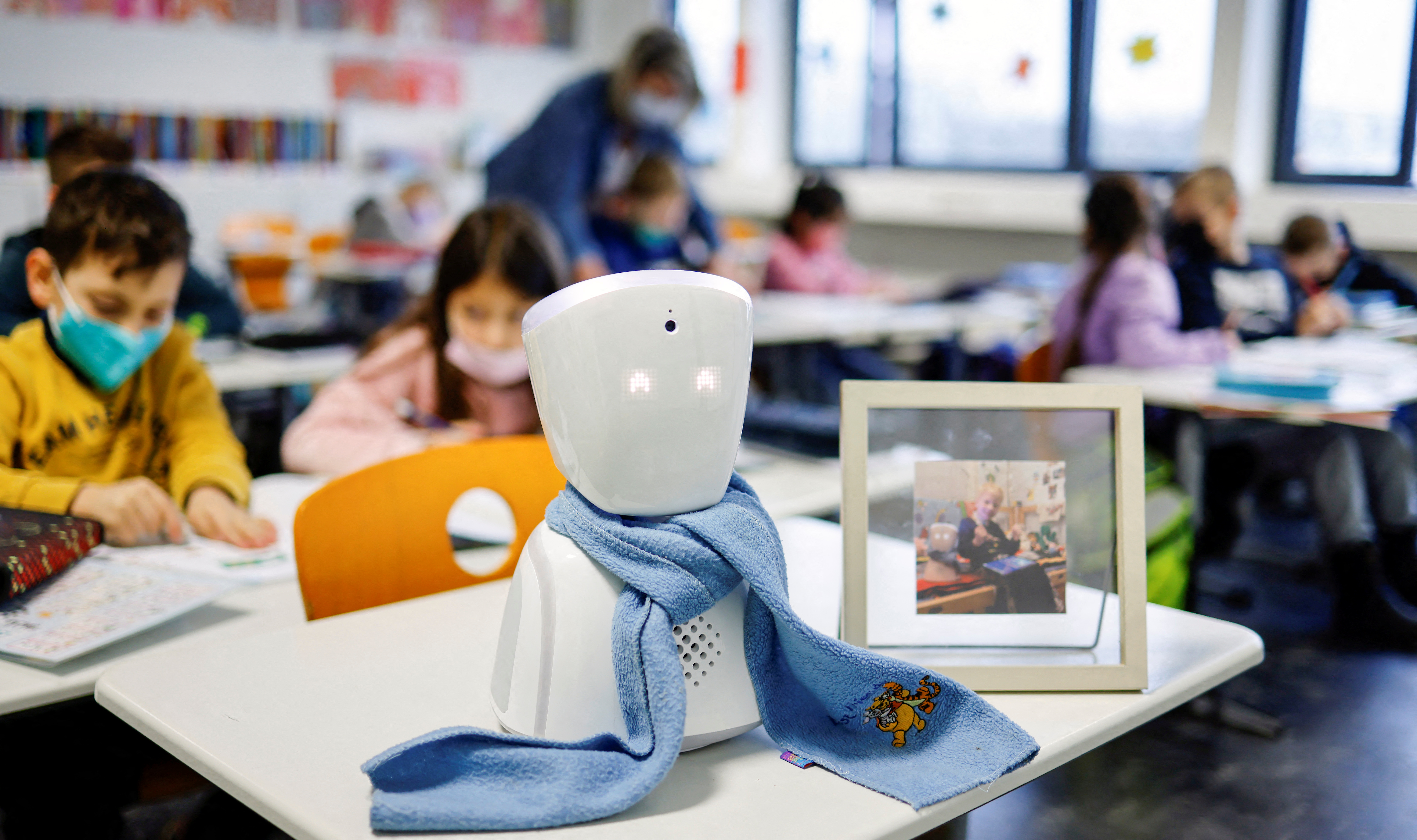 A seven-year-old schoolboy Joshua attends his school lesson via a robot avatar, placed in his classroom, in Berlin, Germany January 13, 2022. REUTERS/Hannibal Hanschke