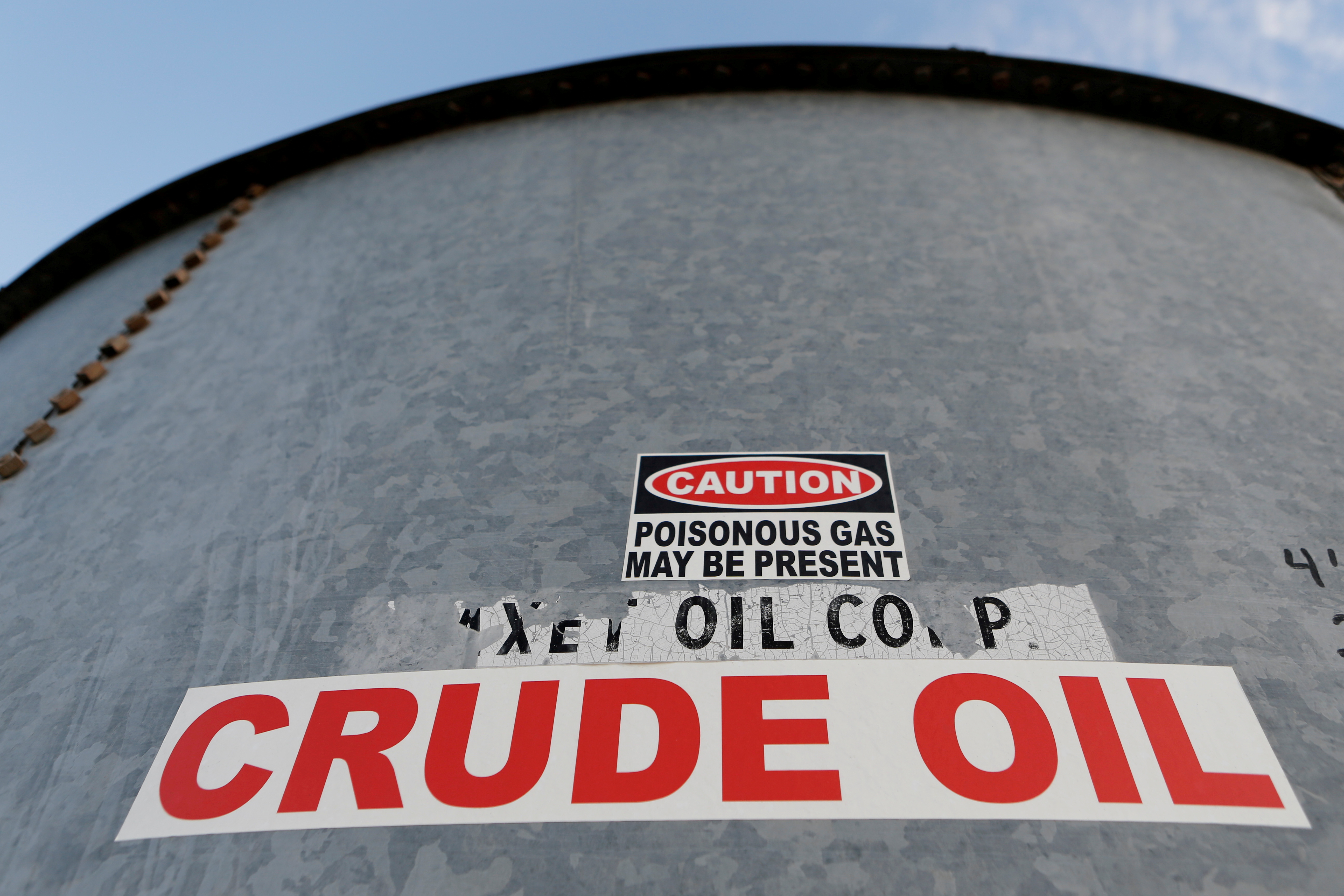 A sticker reads crude oil on the side of a storage tank in the Permian Basin in Mentone, Loving County, Texas, U.S. November 22, 2019. Picture taken November 22, 2019.   REUTERS/Angus Mordant/File Photo