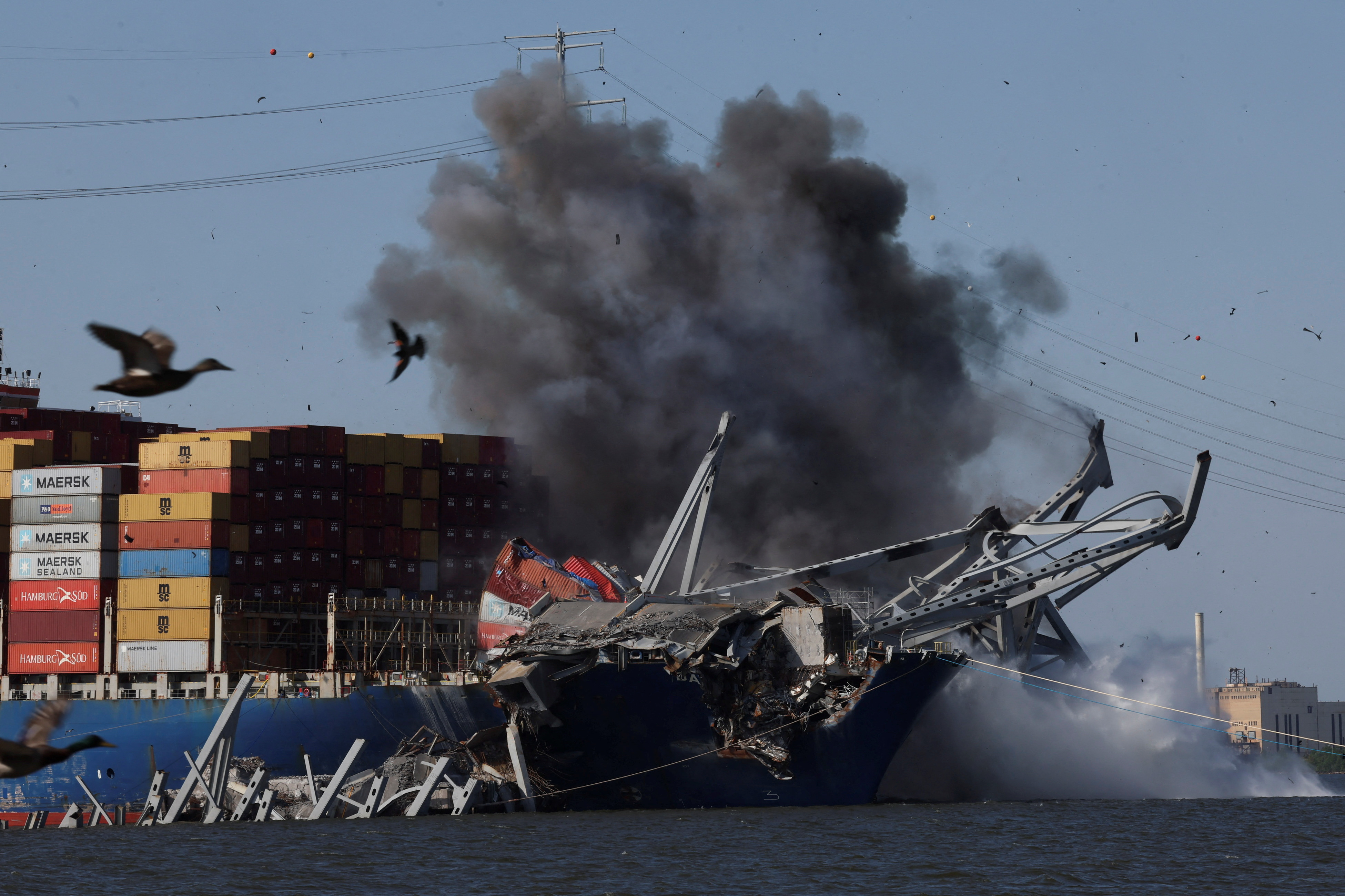 Explosives are detonated to free container ship Dali from Baltimore bridge collapse, in Baltimore