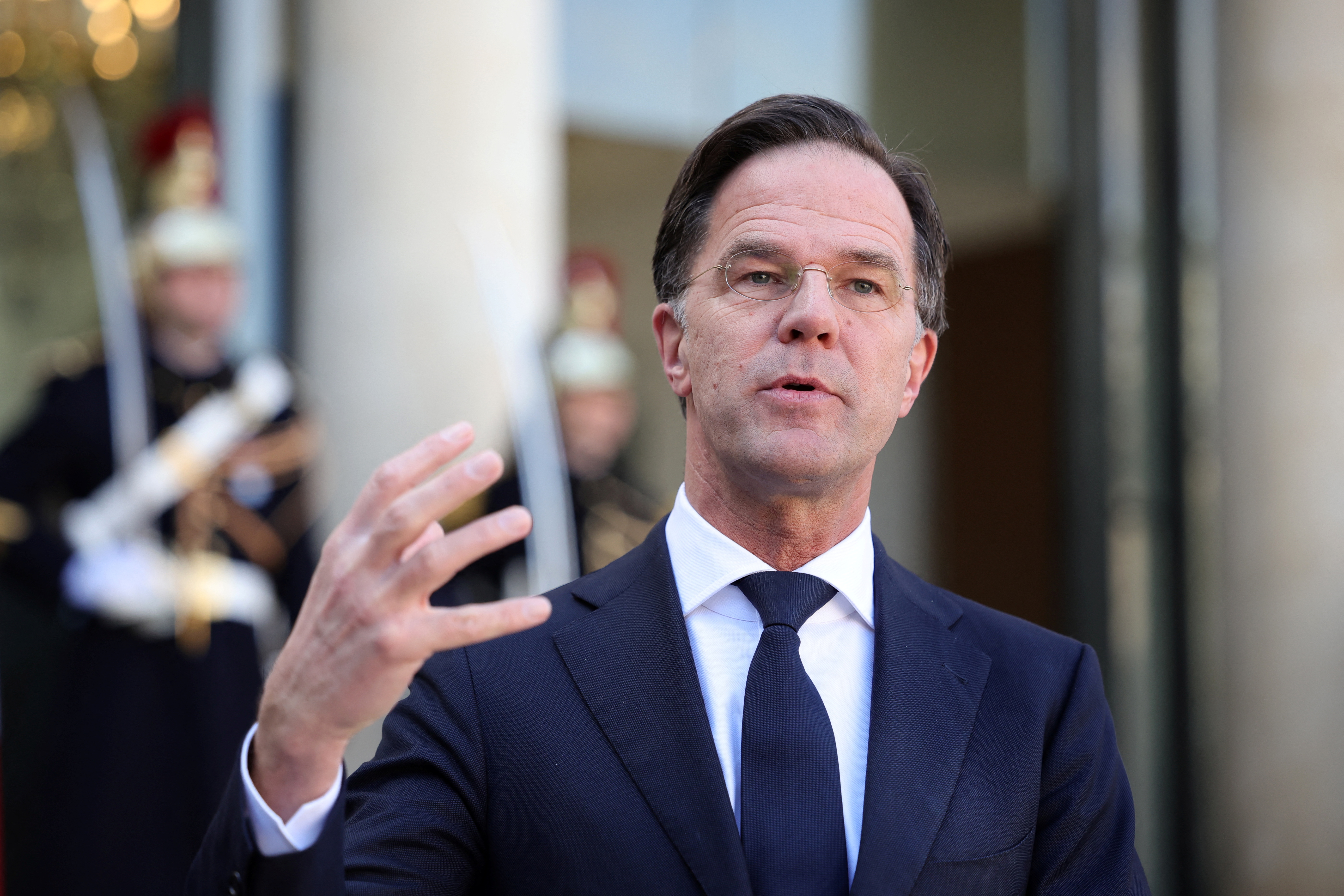 Dutch Prime Minister Mark Rutte delivers a joint statement with French President Emmanuel Macron (not seen) before a meeting at the Elysee Palace in Paris