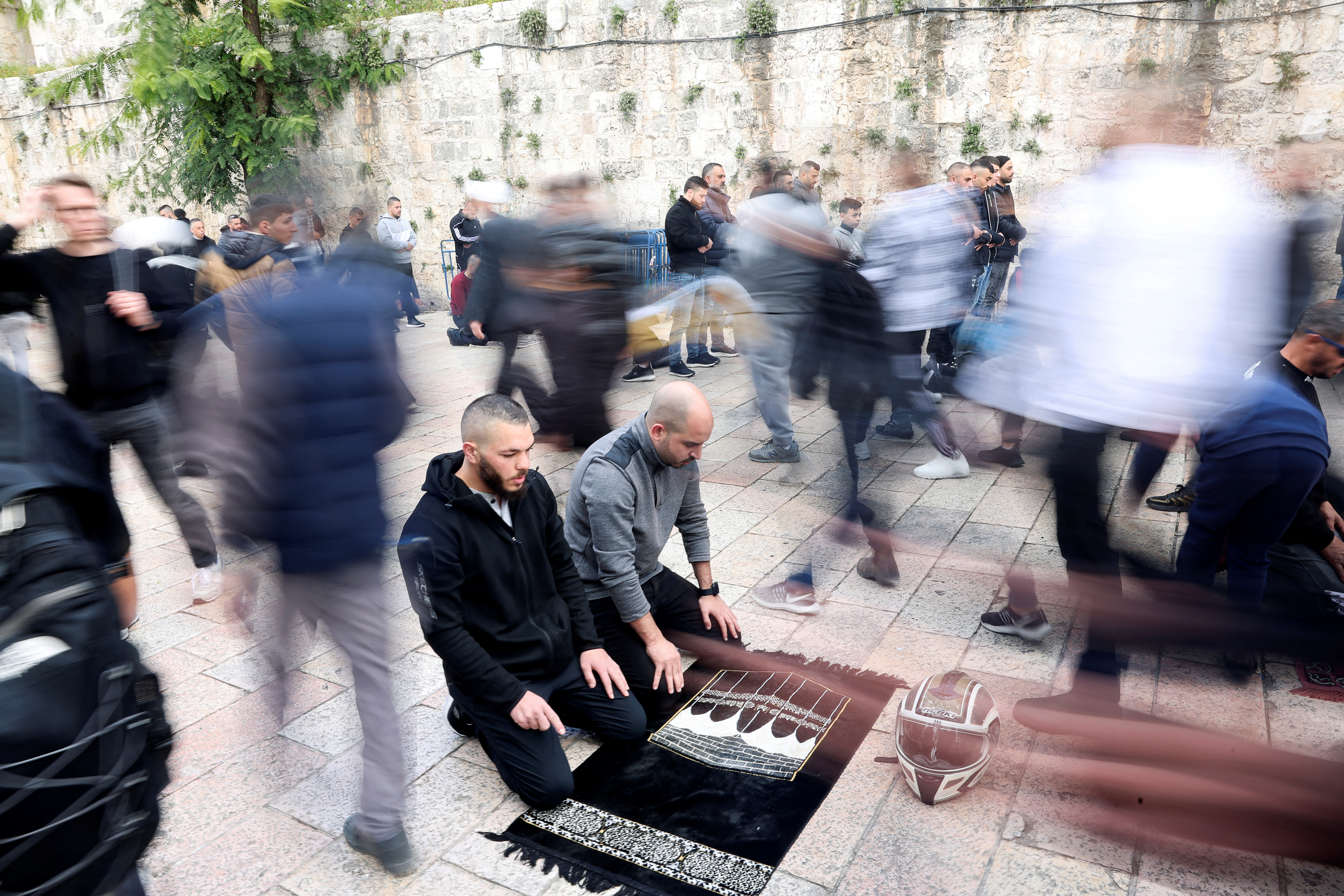 Muslim worshippers pray, on the day of the first Friday prayers during Ramadan, in Jerusalem