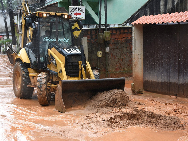 Machinery removes mud following heavy rains, in Angra dos Reis