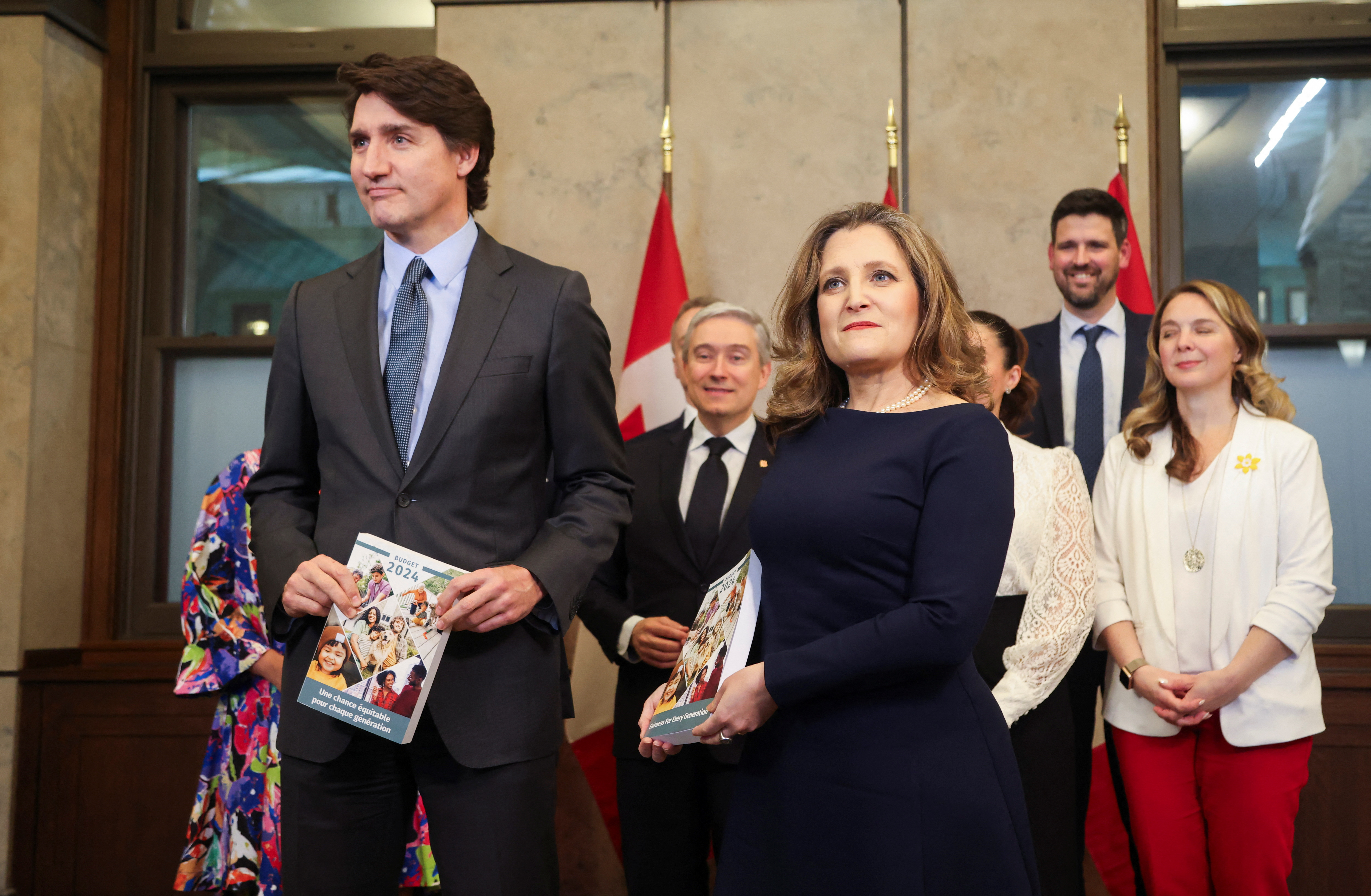Canada's Prime Minister Justin Trudeau and Finance Minister Chrystia Freeland pose for a picture holding the 2024-25 budget in Ottawa