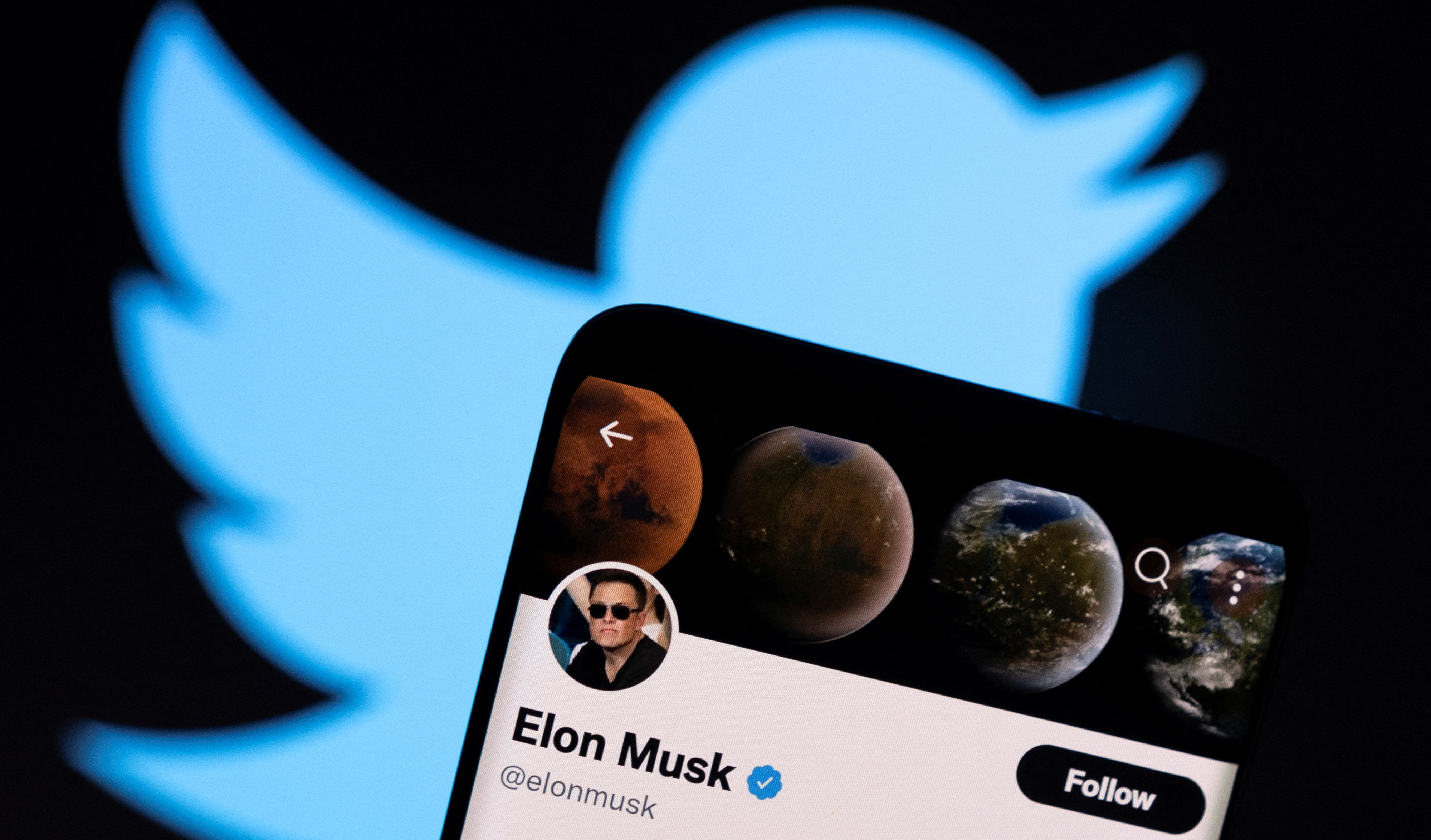 A photo illustration shows Elon Musk's twitter account and the Twitter logo