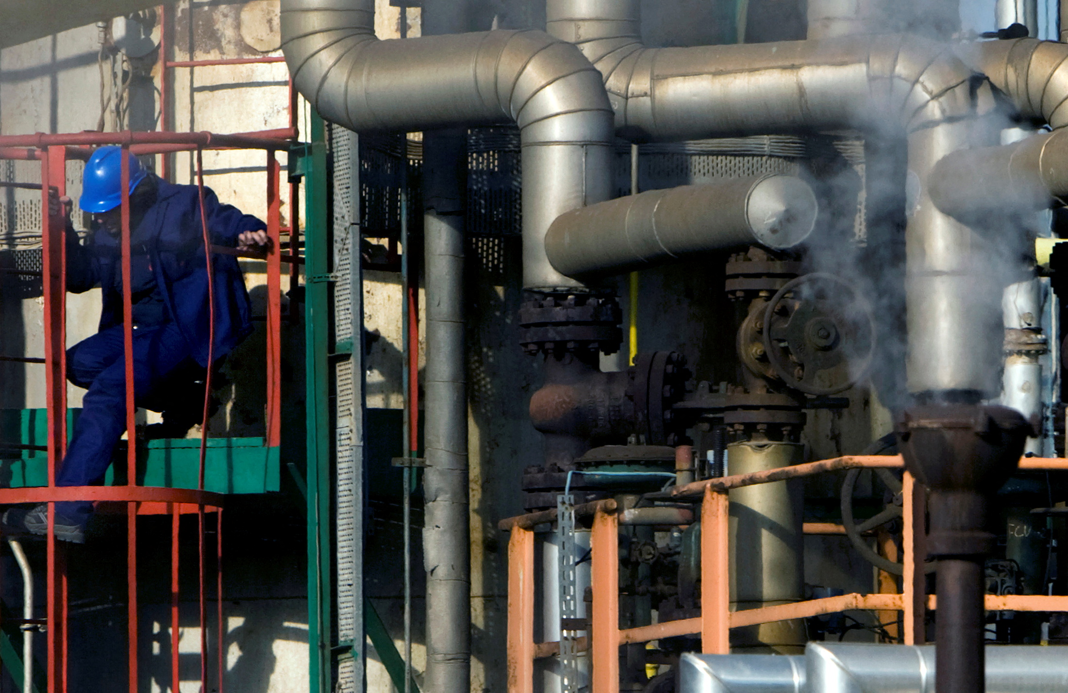Employee works at Repsol YPF's refinery plant in Cartagena