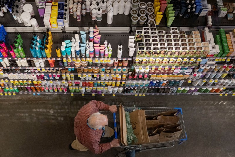 A person pushes a shopping cart in a supermarket in Manhattan, New York City