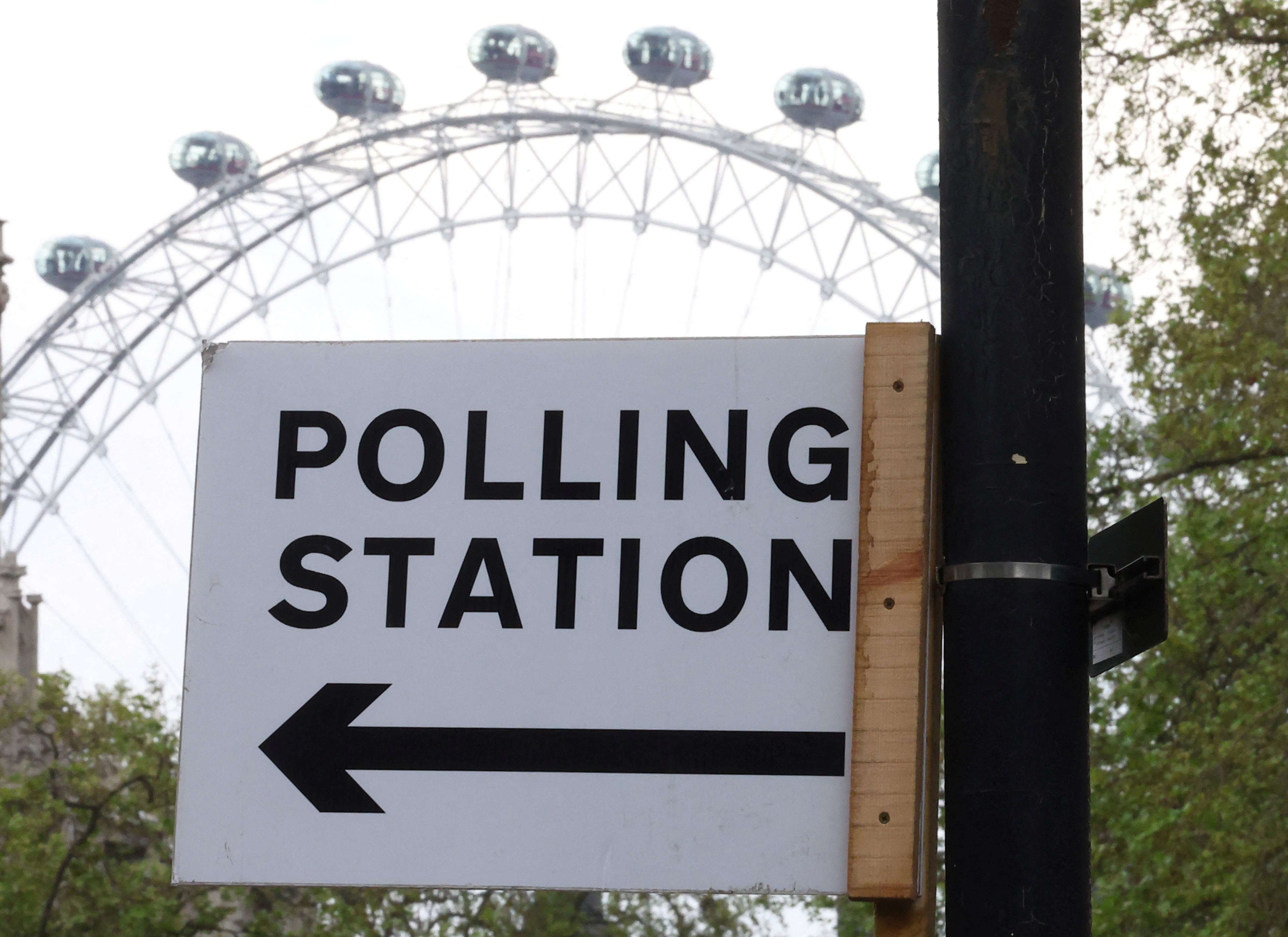 Polling station sign seen ahead of local elections, in London