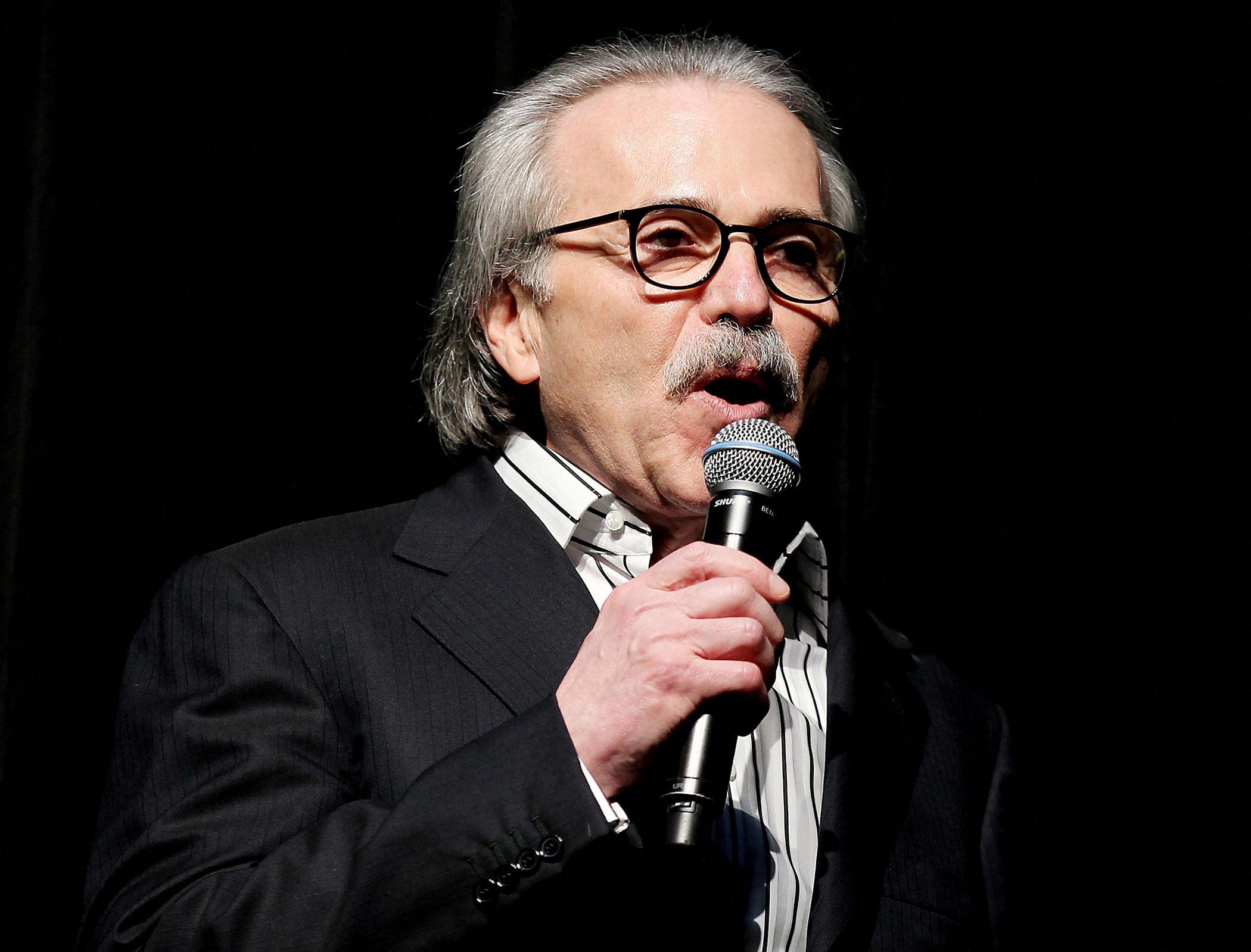 David Pecker, chair and CEO of American Media, speaks at the Shape and Men's Fitness Super Bowl Party in New York