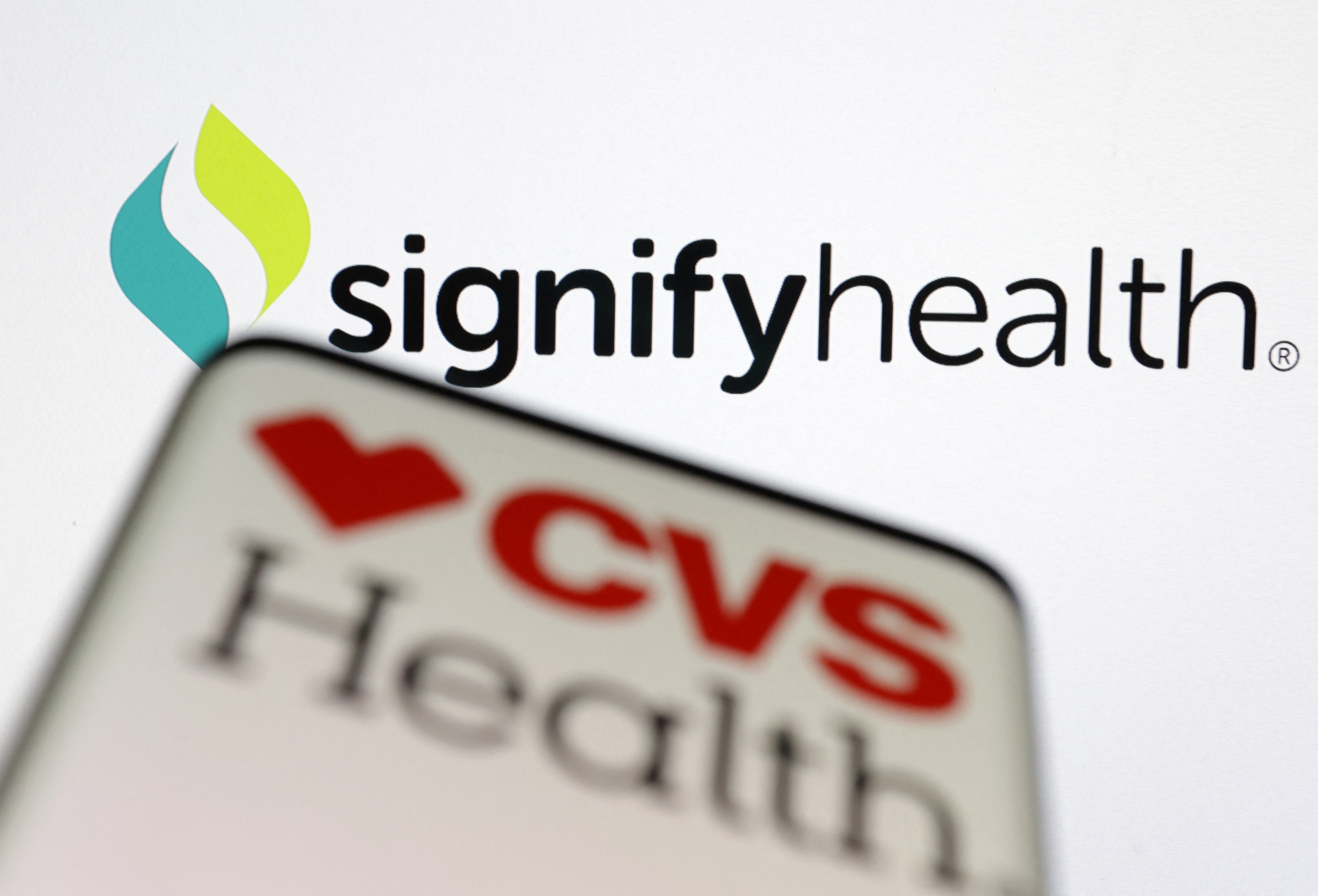 Illustration shows CVS Health and Signifyhealth logos