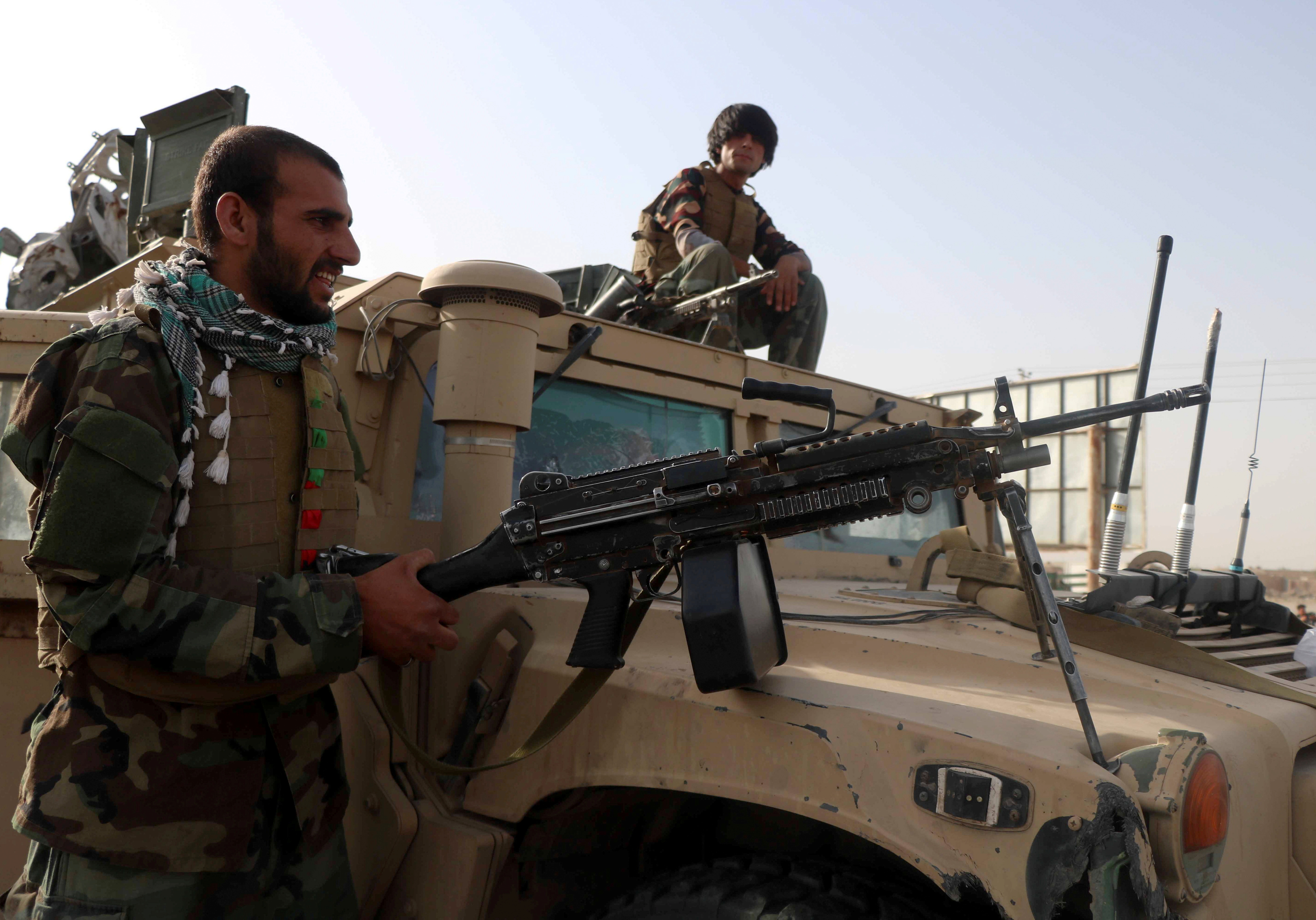 Afghan National Army soldiers keep watch at checkpoint in Guzara district of Herat province