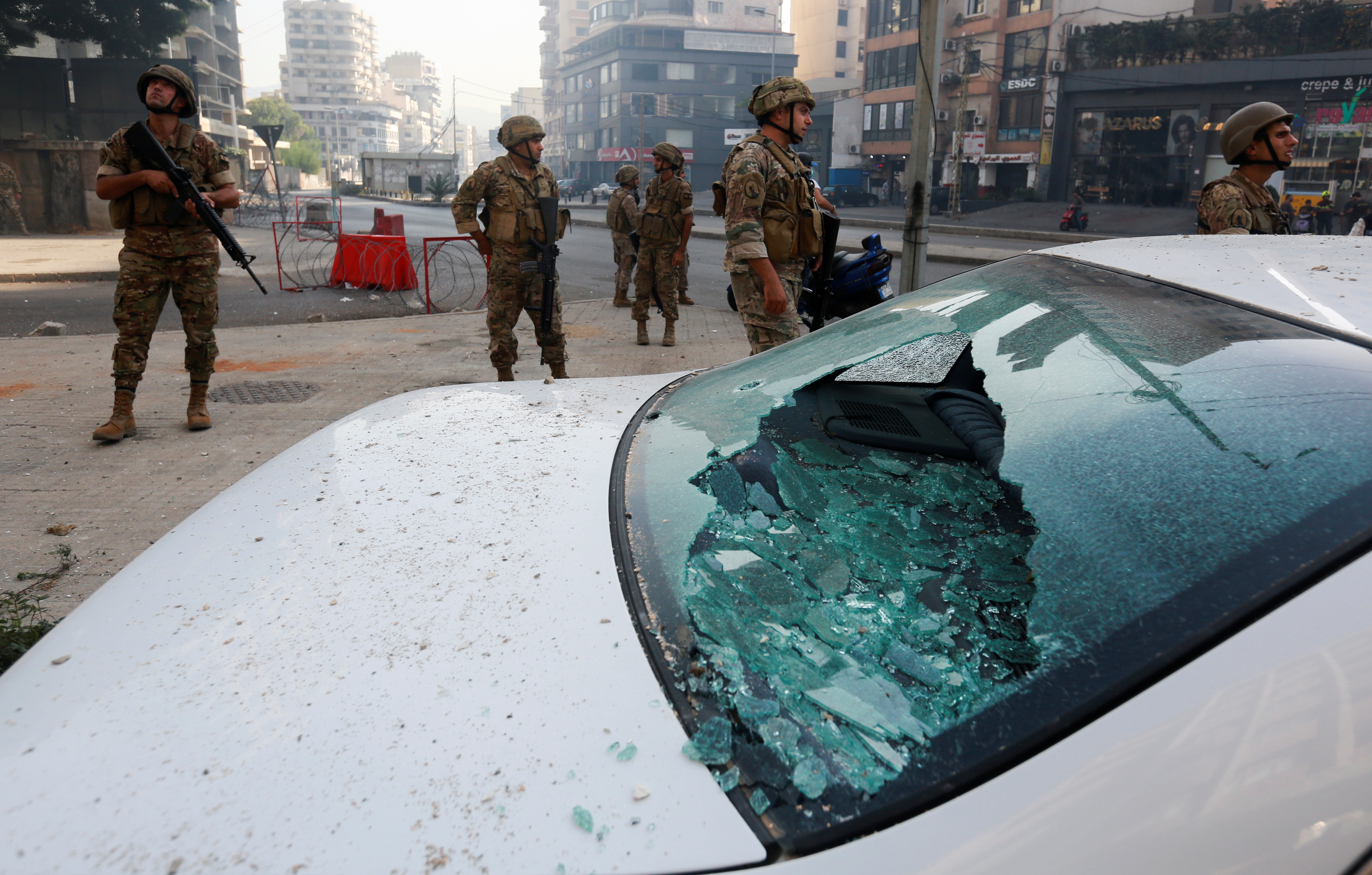 A damaged vehicle is pictured as soldiers are deployed after gunfire erupted in Beirut, Lebanon October 14, 2021. REUTERS/Aziz Taher