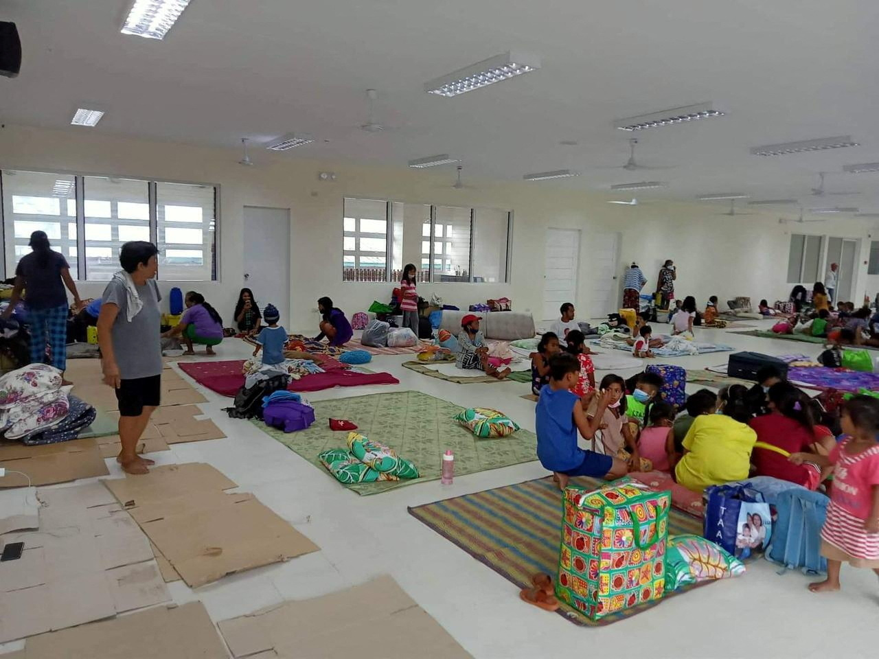 Residents are seen inside an evacuation centre in Aurora Province, Philippines